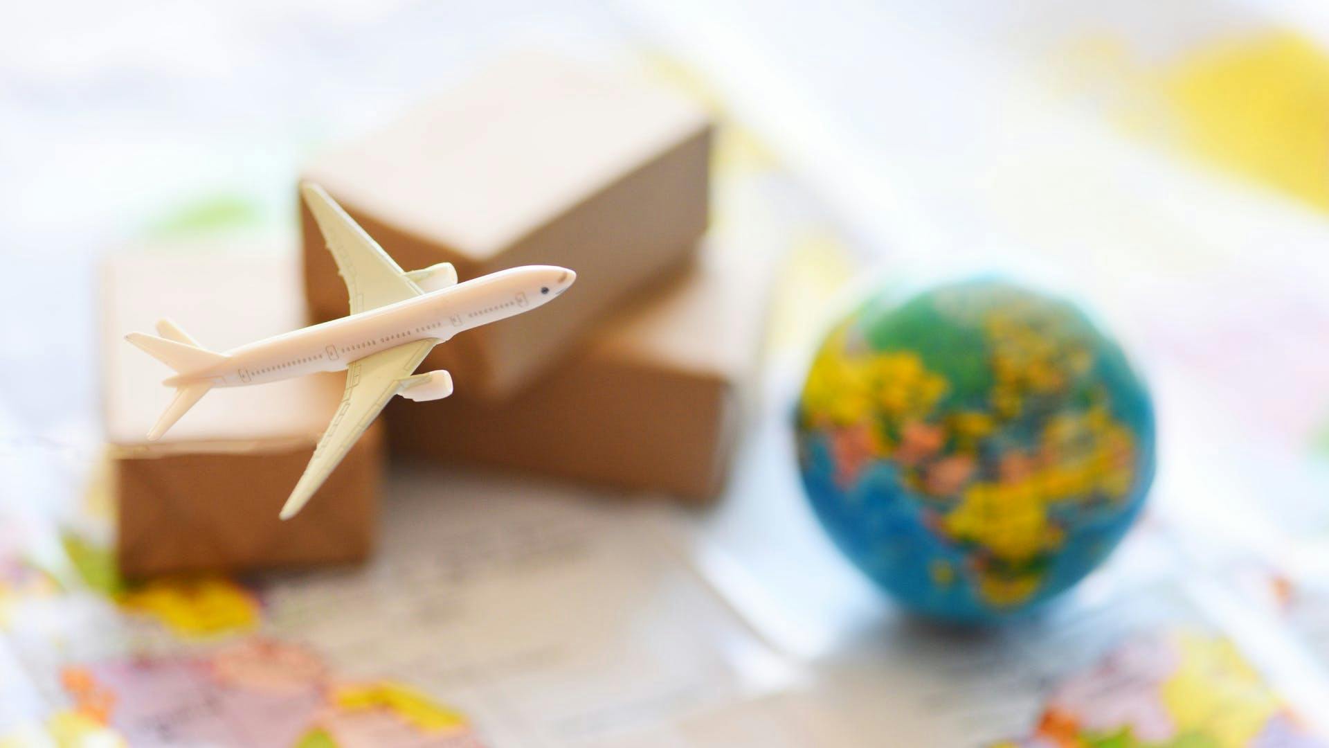 A small plane with packages shipping to world.