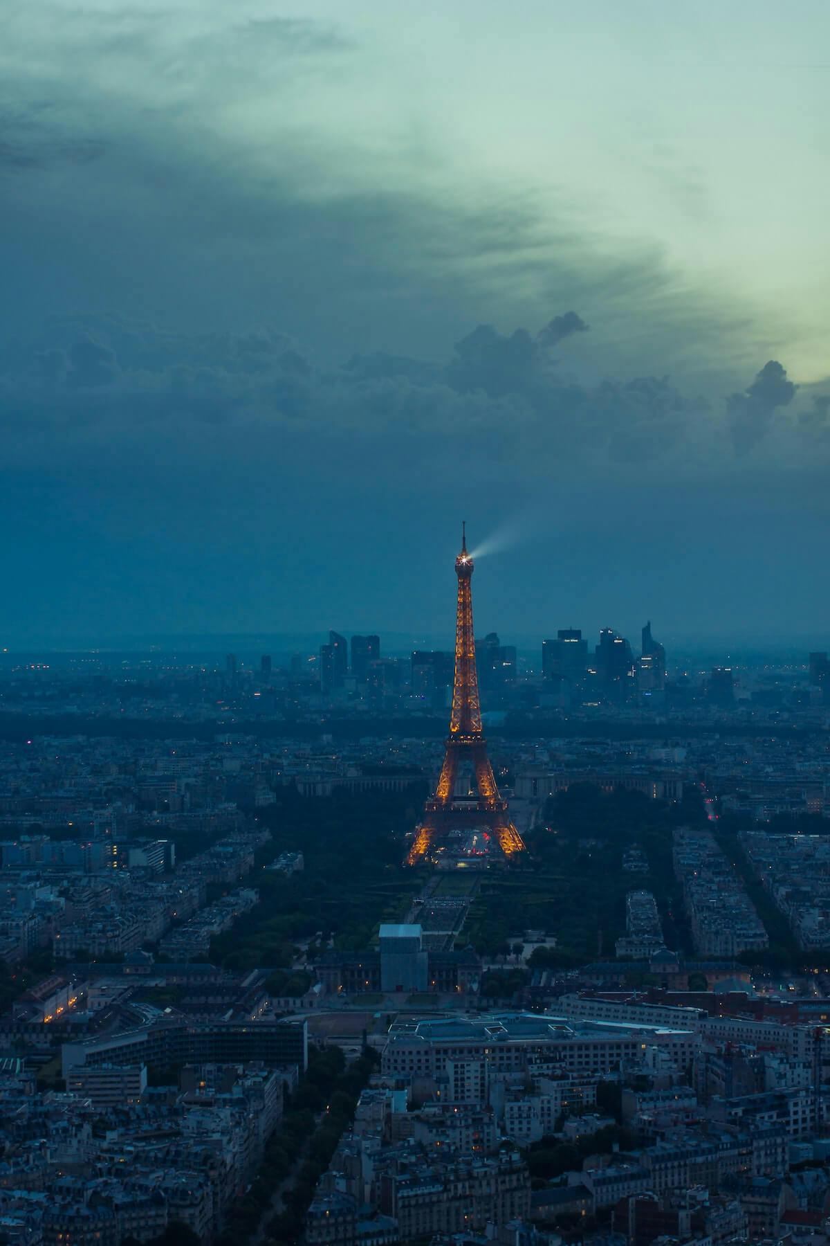 a shot from Eiffel tower of Paris, in the style of moody lighting