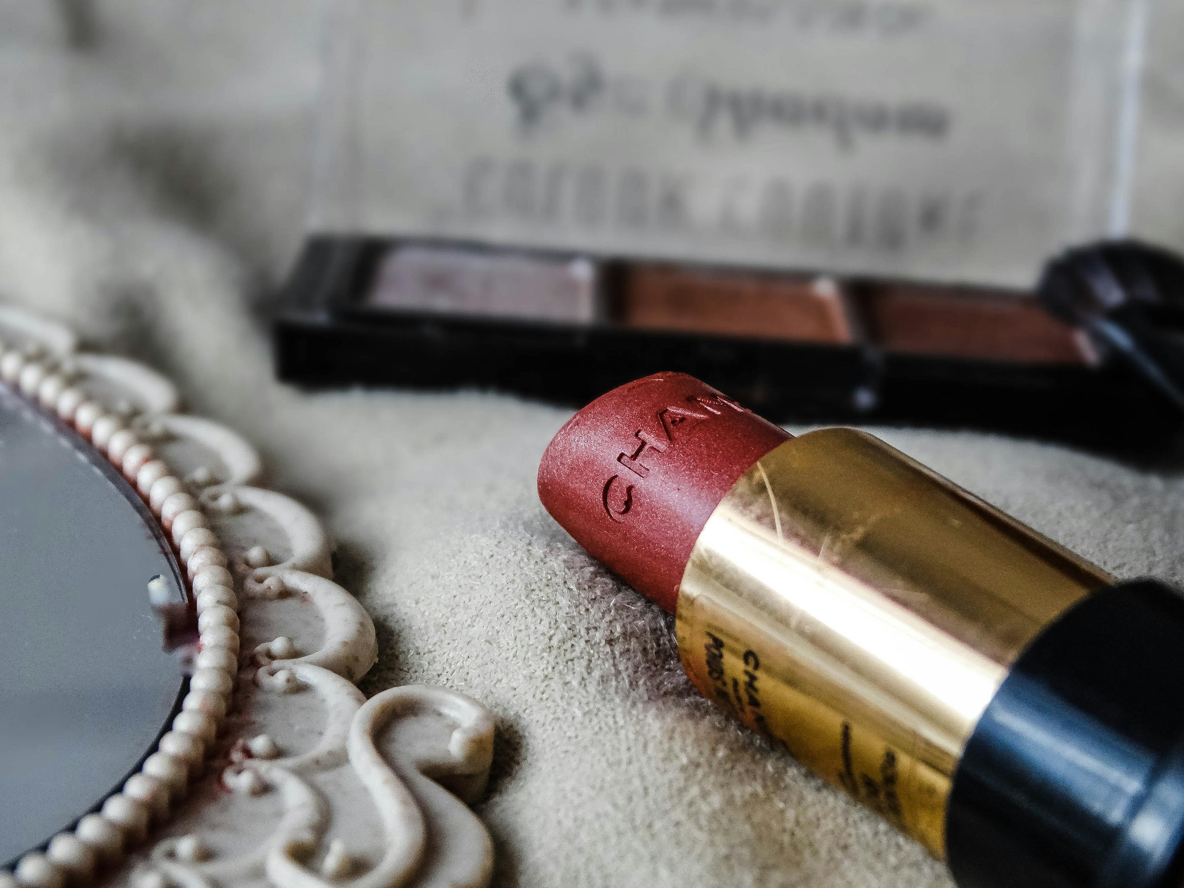 A lipstick branded Chanel focused on the image. 