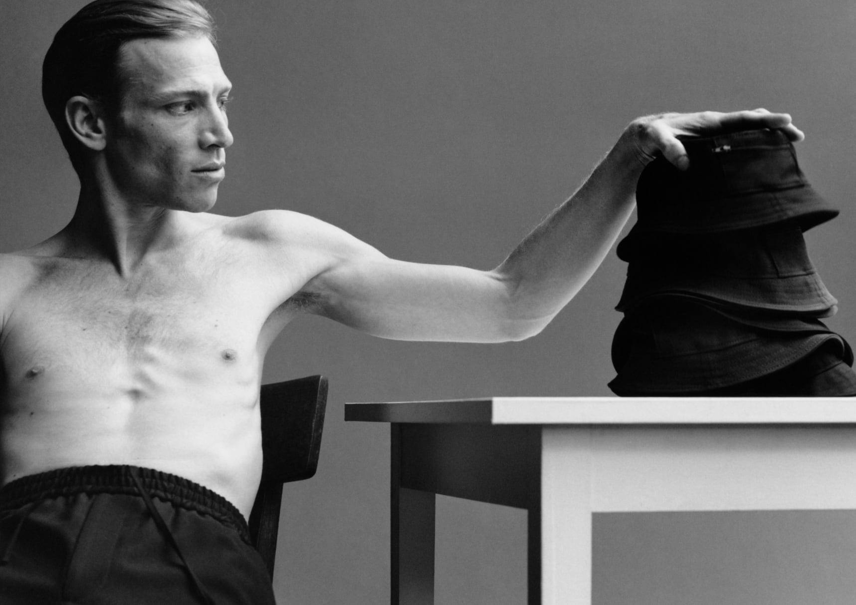 a man with his shirt off, in a rack, in the style of bertil nilsson, a man with his shirt off, in a rack, in the style of bertil nilsson,