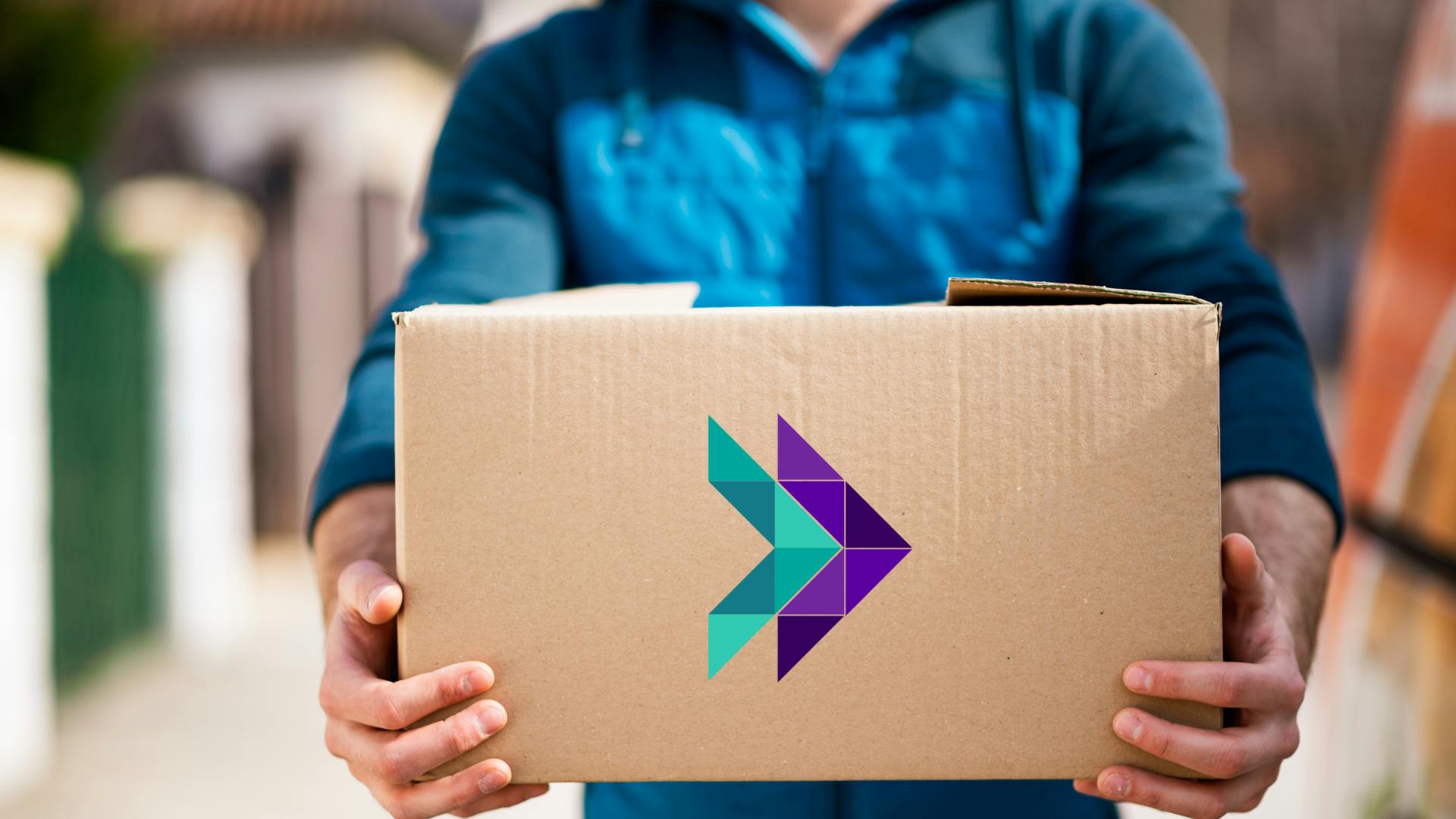 Courier carrying package with Forwardme logo on it.