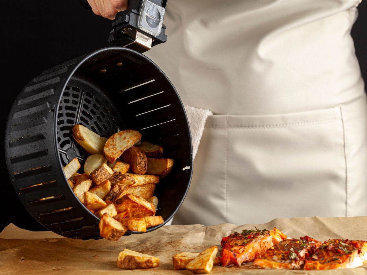 Fries and chicken cooked in the fryer.