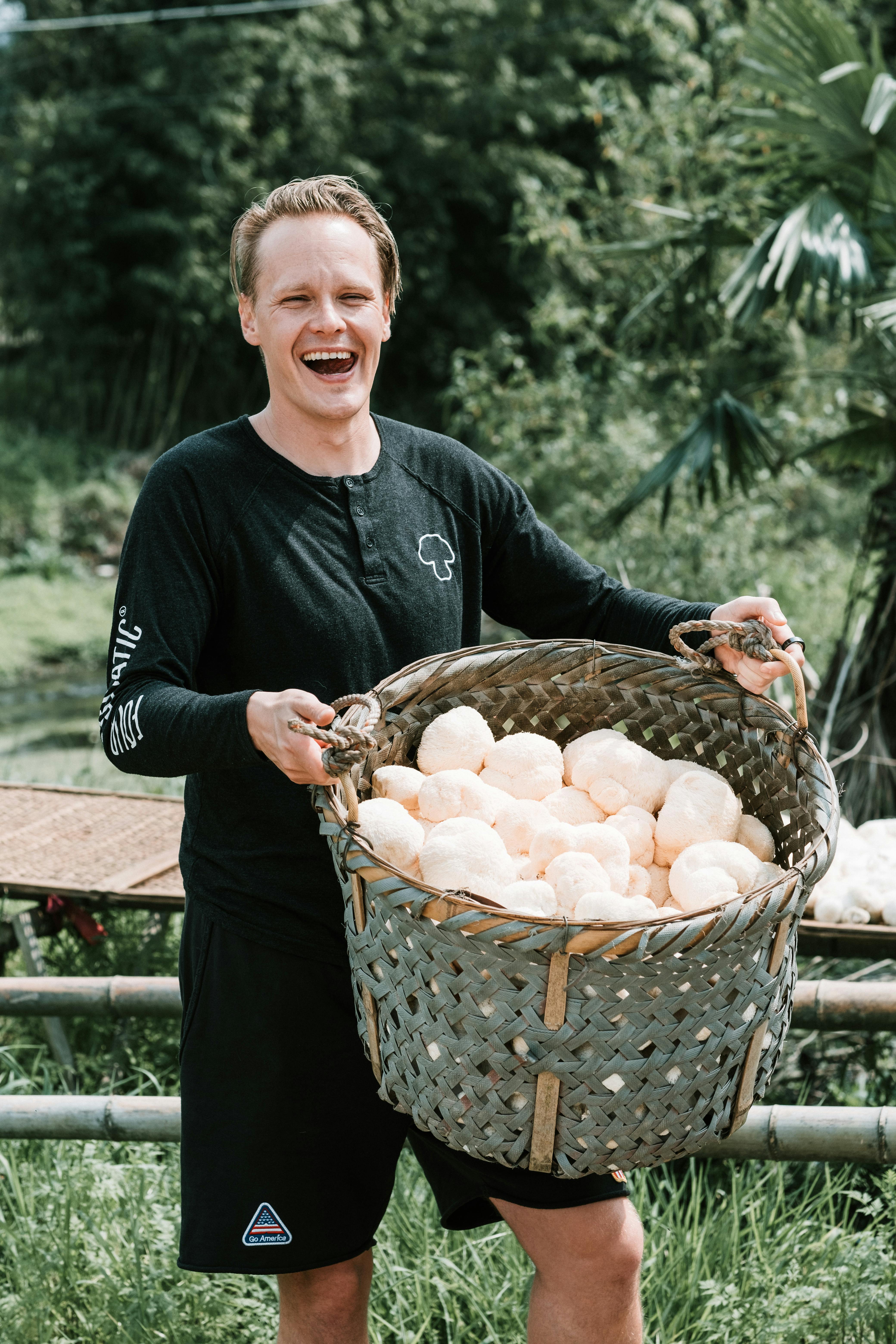 Tero, founder of Four Sigmatic, harvesting lion’s mane fruiting bodies