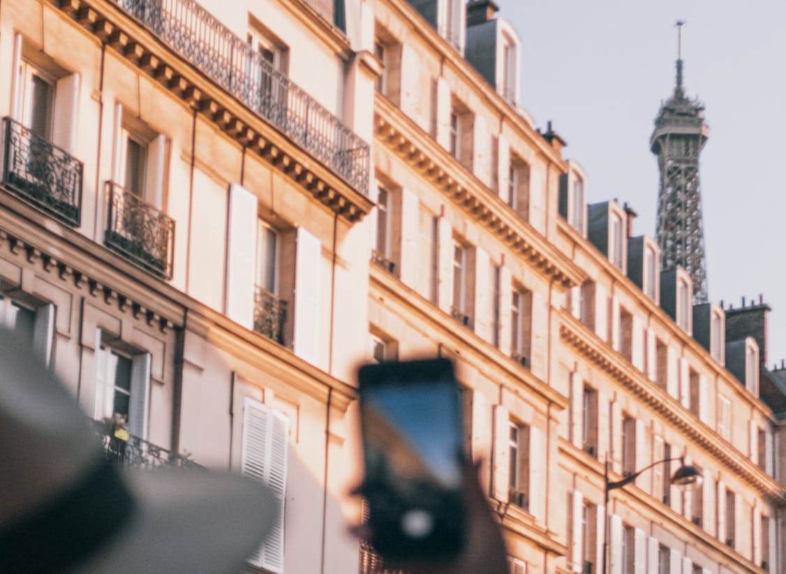 A person using a smartphone in Paris