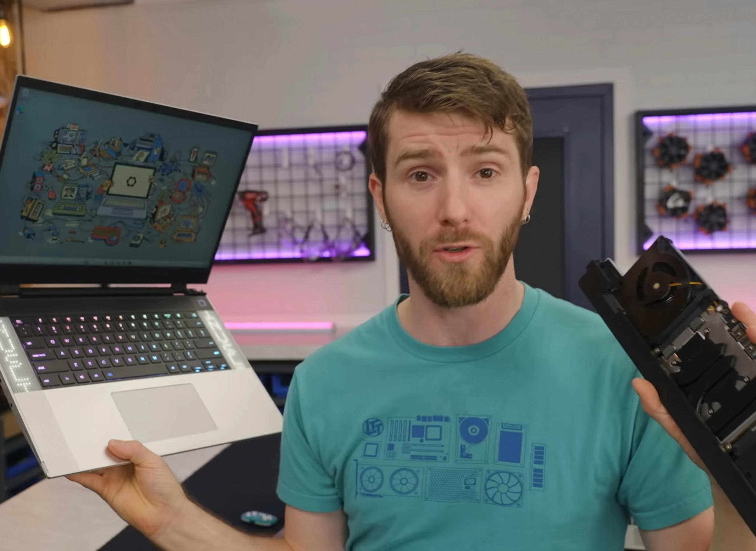 Linus from LTT holding a Framework Laptop 16 and Mainboard