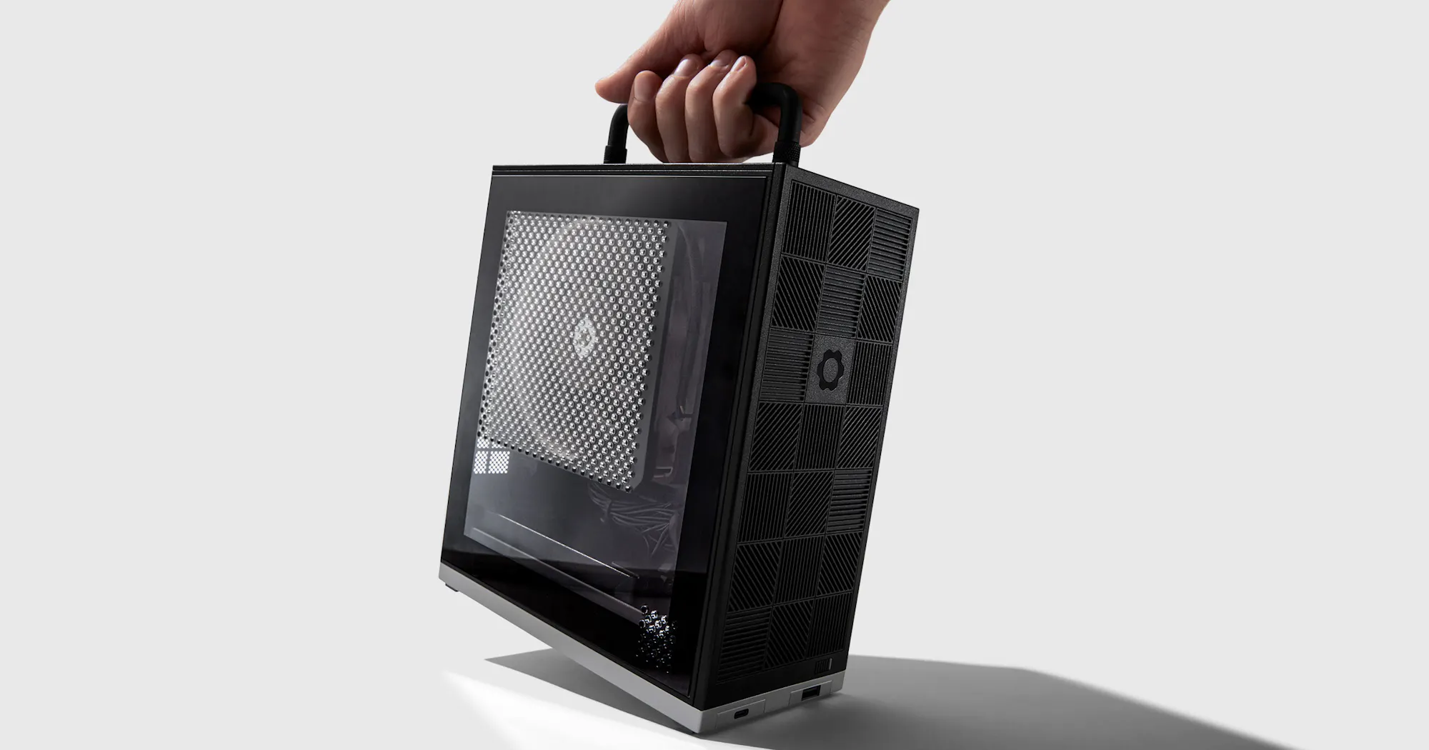 Framework Desktop mini PC, a compact beige and black mini-ITX case shown from the front