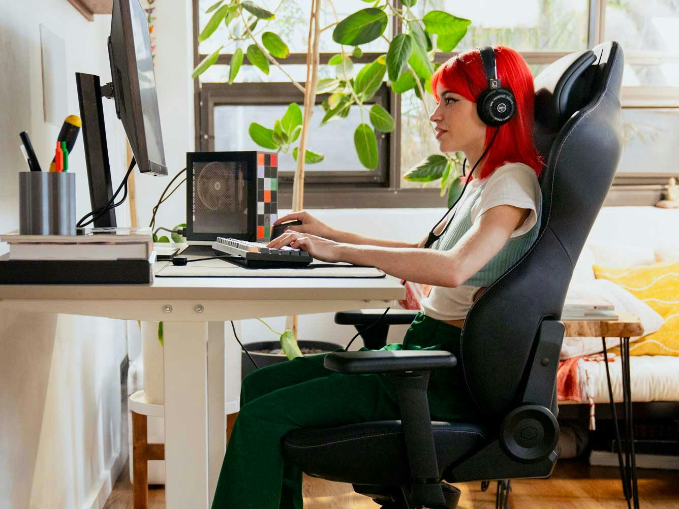Image of person at their desk with a Framework Desktop