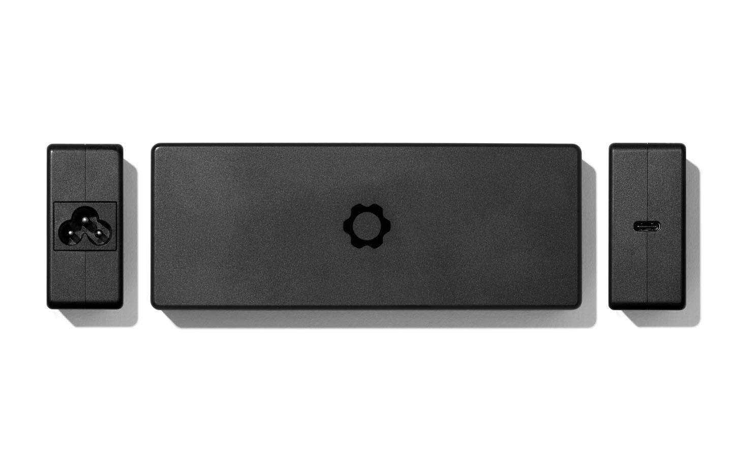 Top-down studio shot of a 240W USB-C power adapter.