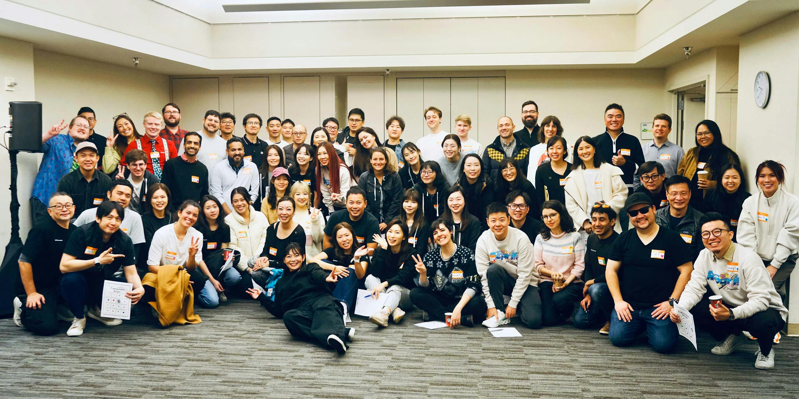 A large group photo of the entire Framework team smiling for the camera.