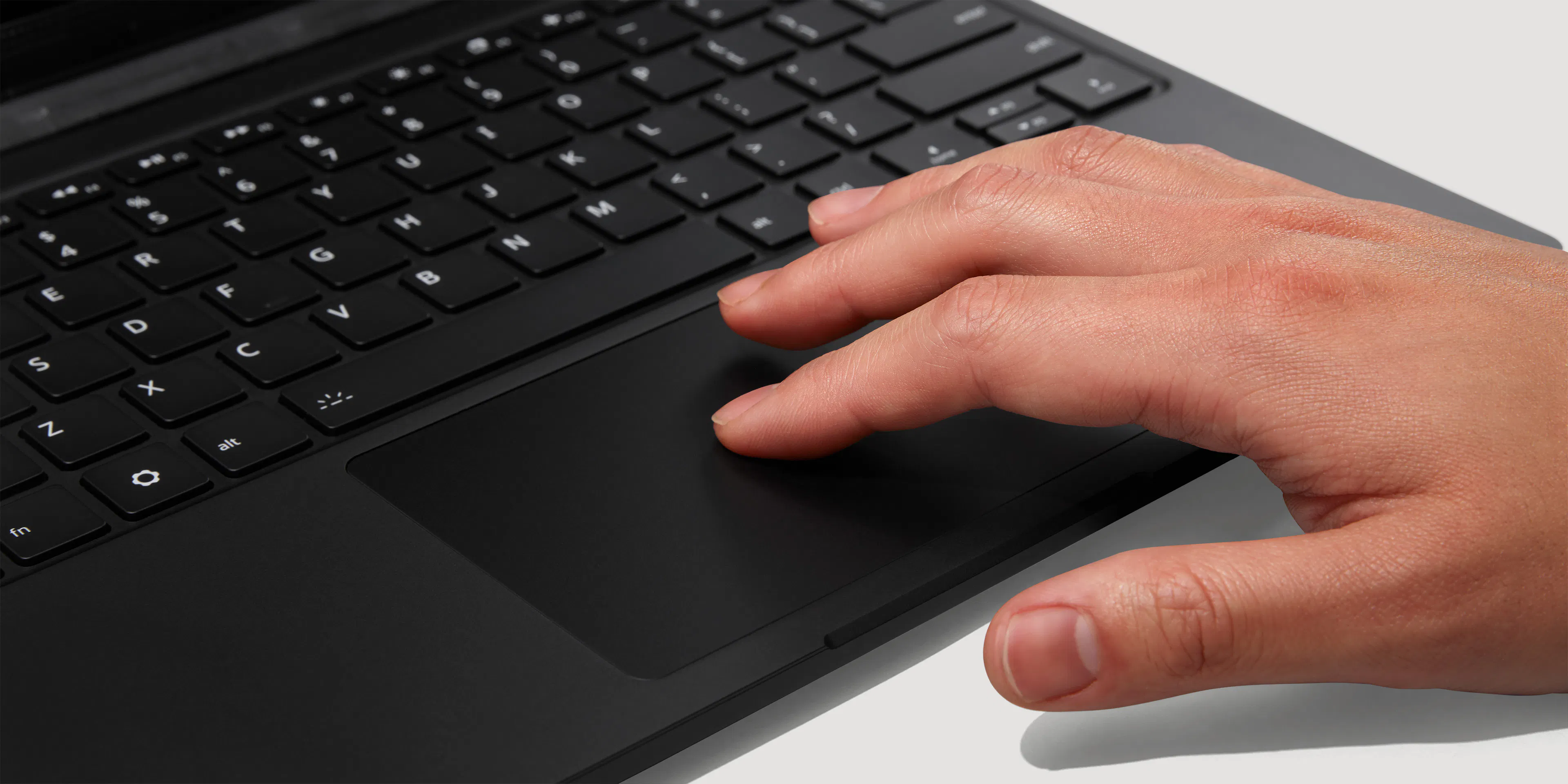 A tight close-up of a Framework Laptop 13 Pro Haptic Touchpad in use
