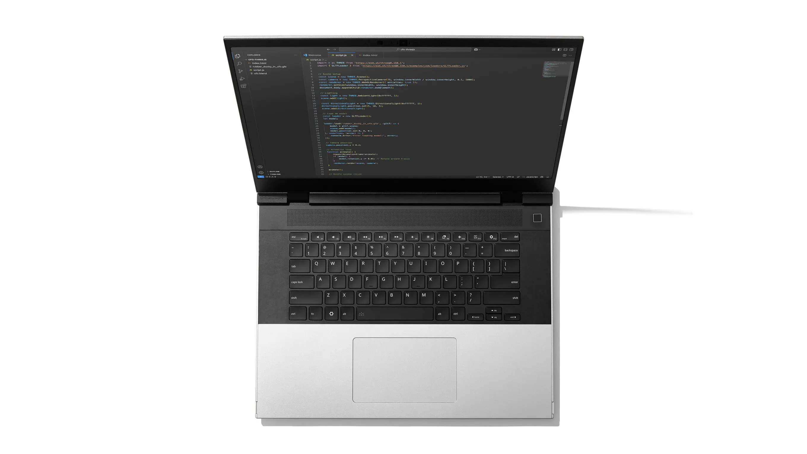 A top-down studio shot of Framework Laptop 16 showcasing the new one piece keyboard and one piece haptic touchpad. 