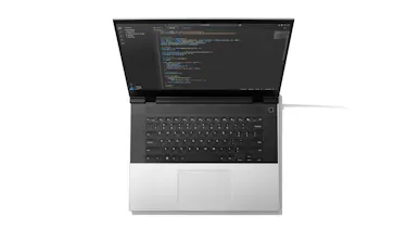 A top-down studio shot of Framework Laptop 16 showcasing the new one piece keyboard and one piece haptic touchpad. 