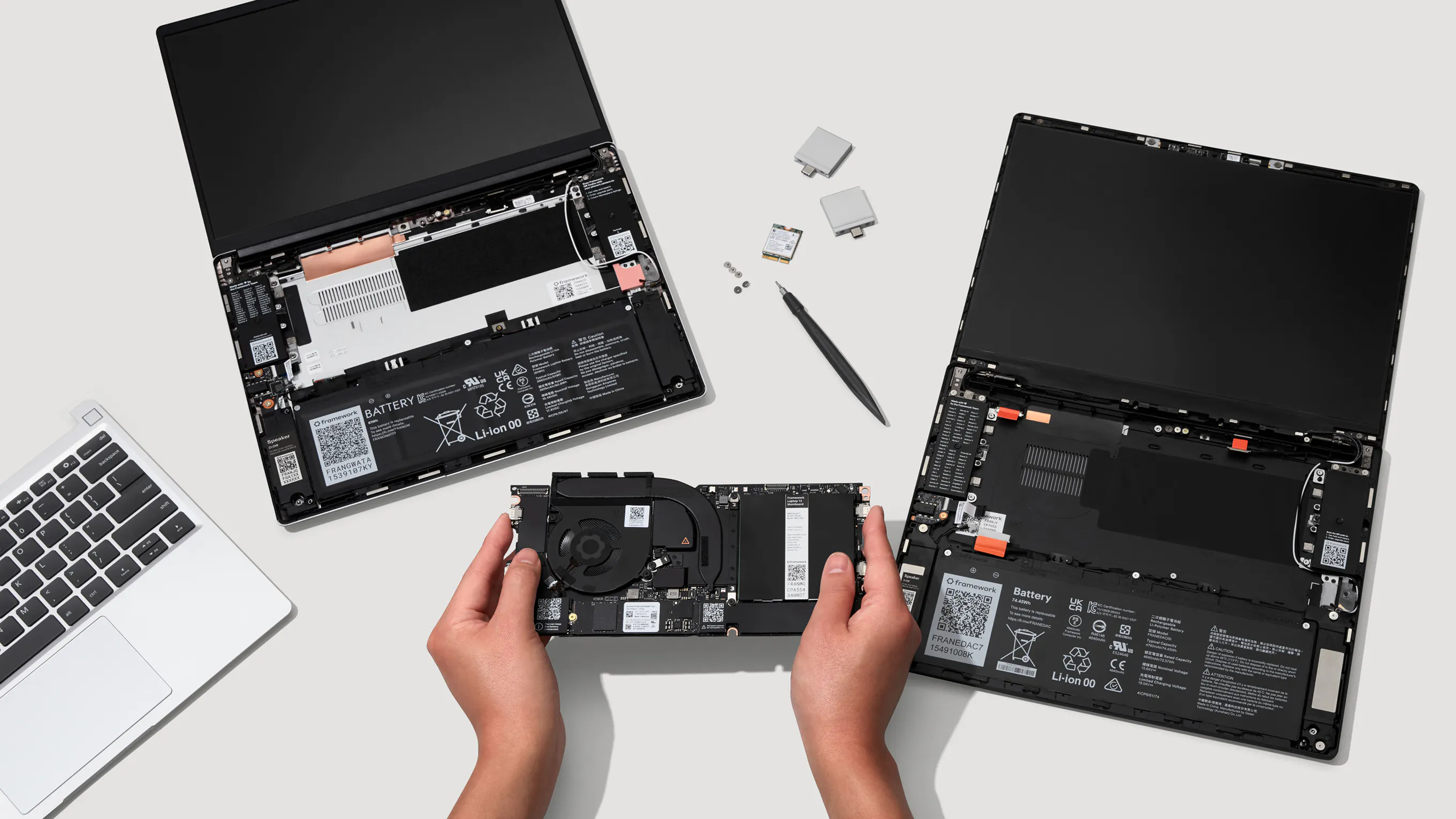 A top-down installation studio shot of Framework Laptop 13 and Framework Laptop 13 Pro.