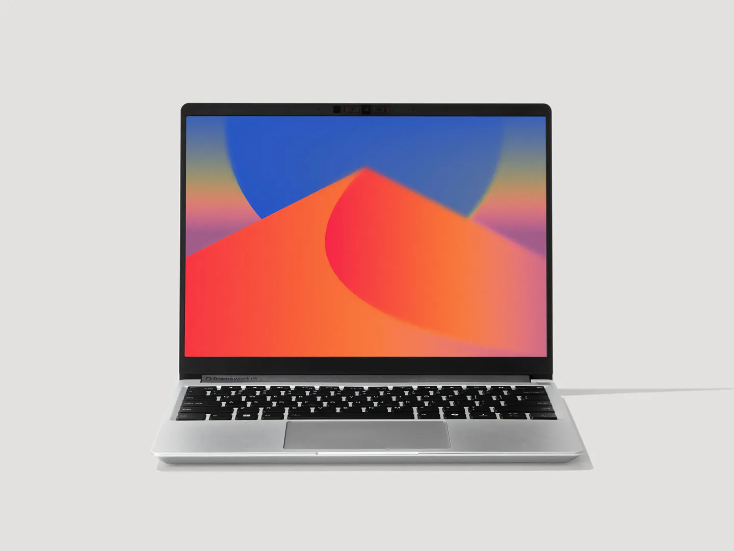 A straight-on shot of a Framework Laptop 13 display with a vibrant wallpaper.