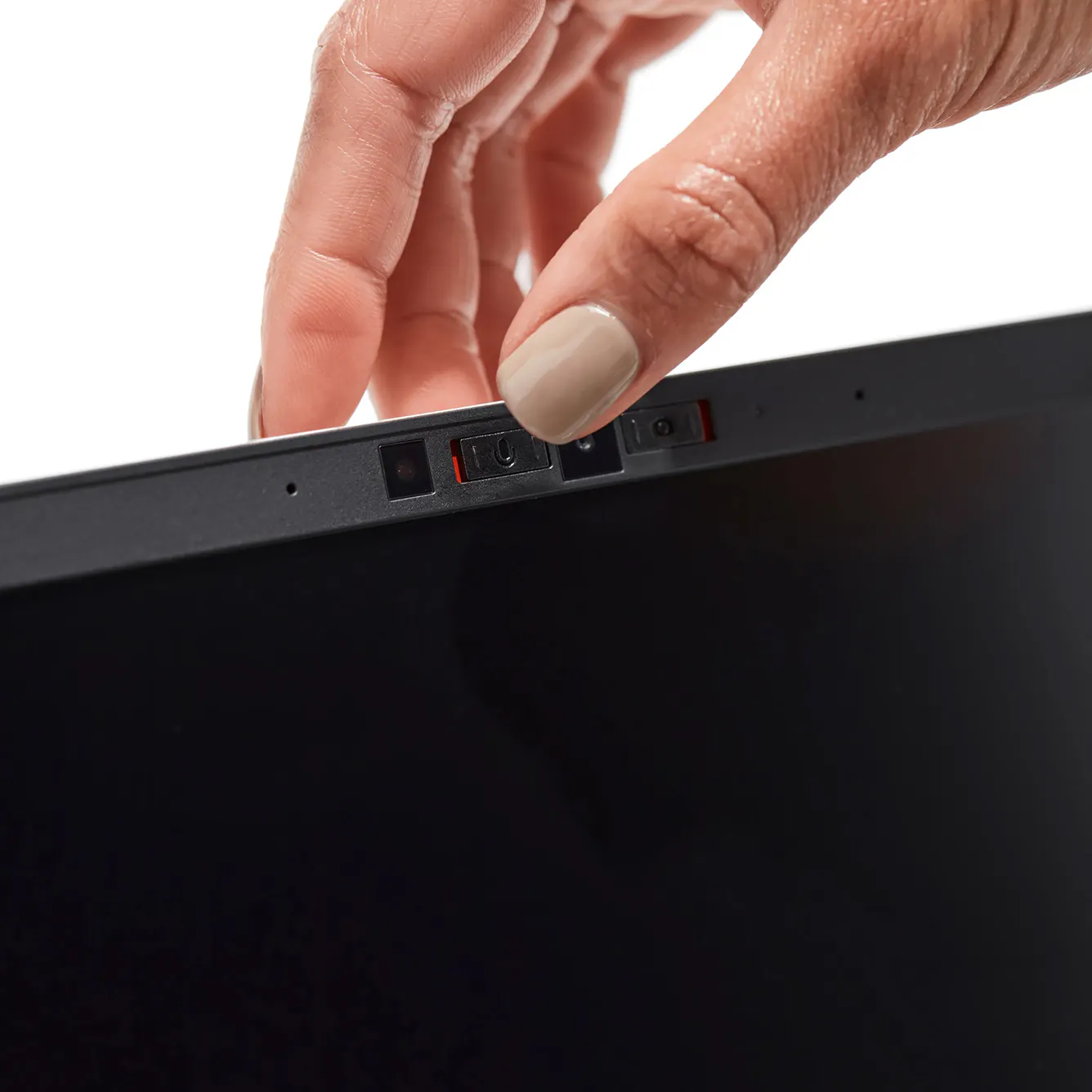 A hand sliding a physical switch on Framework Laptop 13