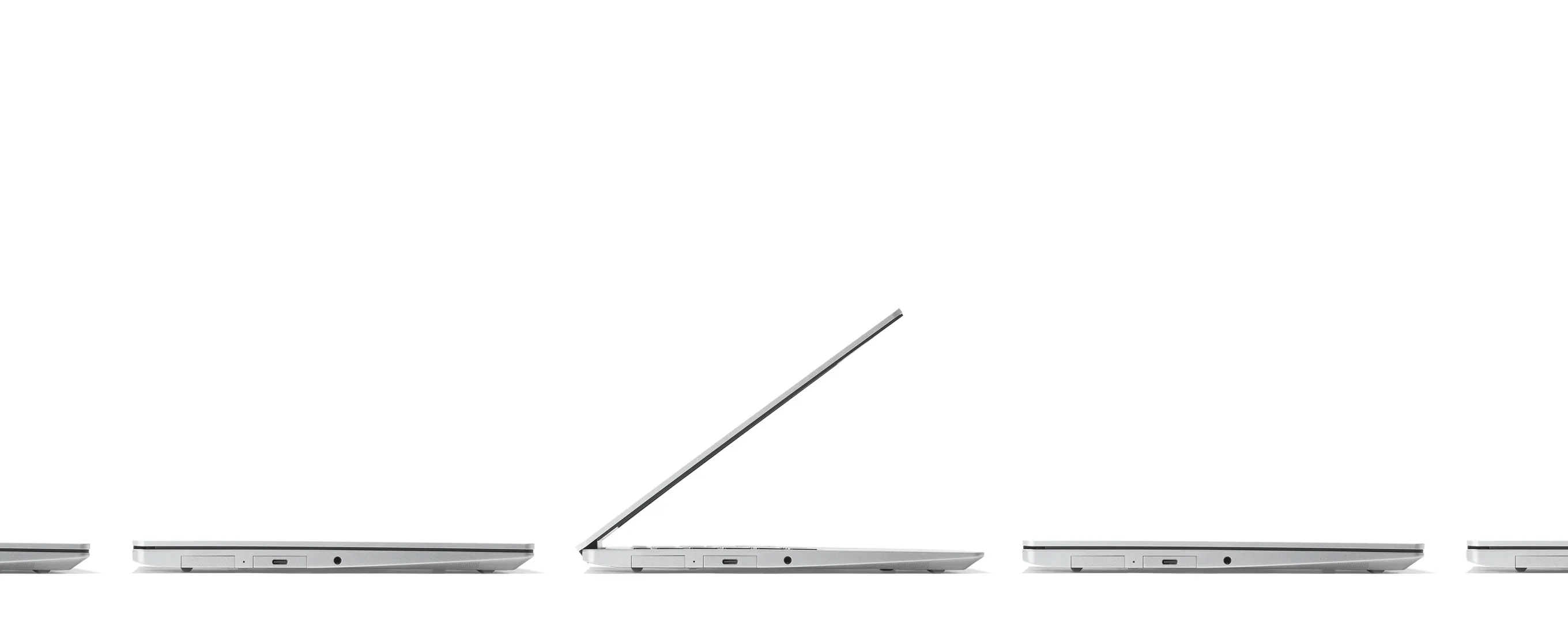 Side angle studio shot of multiple Framework Laptops 13s.