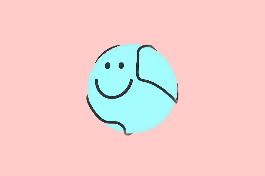 A minimalist 3D render on a soft pink background. It features a bright cyan-blue sphere with a simple black smiley face, partially wrapped in a black modular frame or wire.