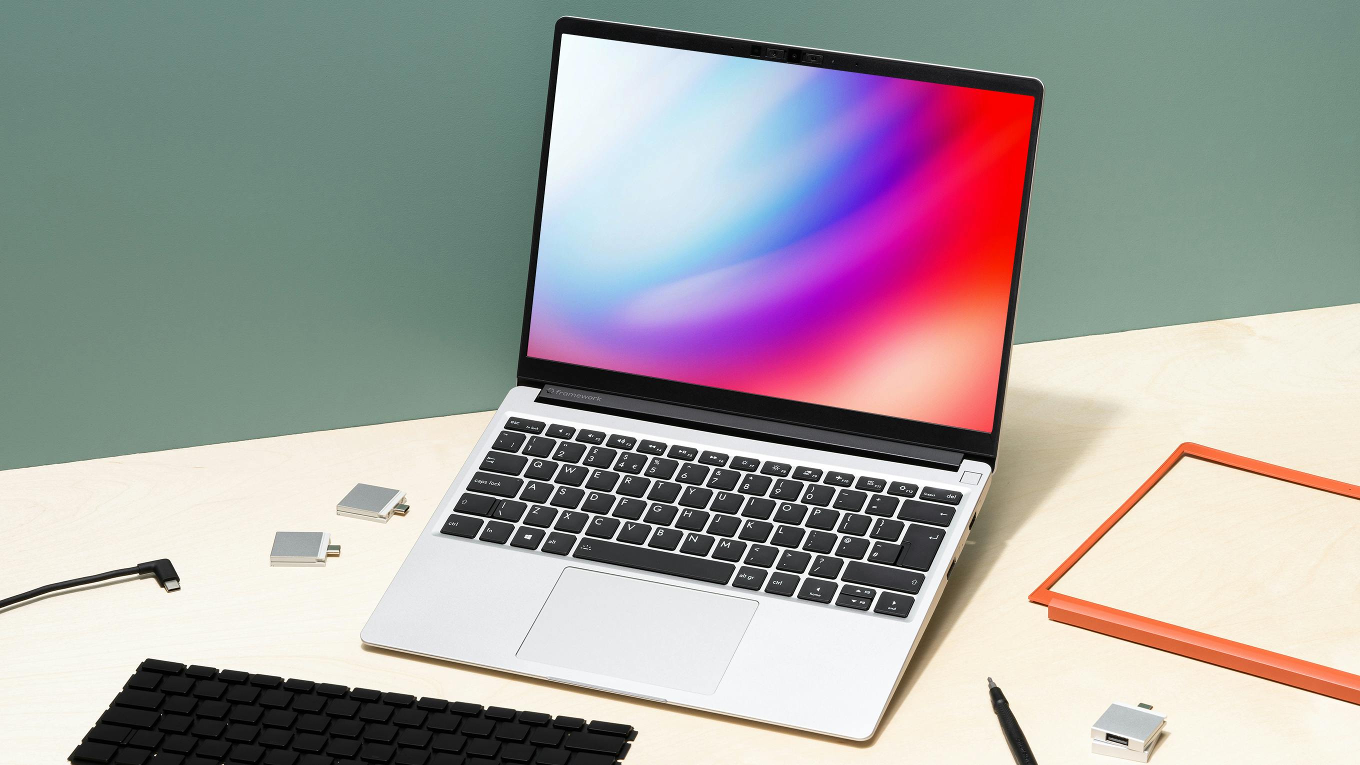 laptop with parts around