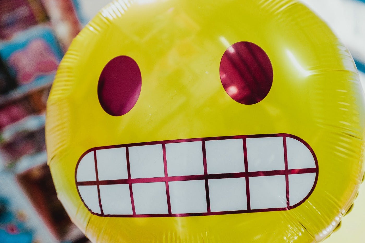 An image of a grimacing face emoji