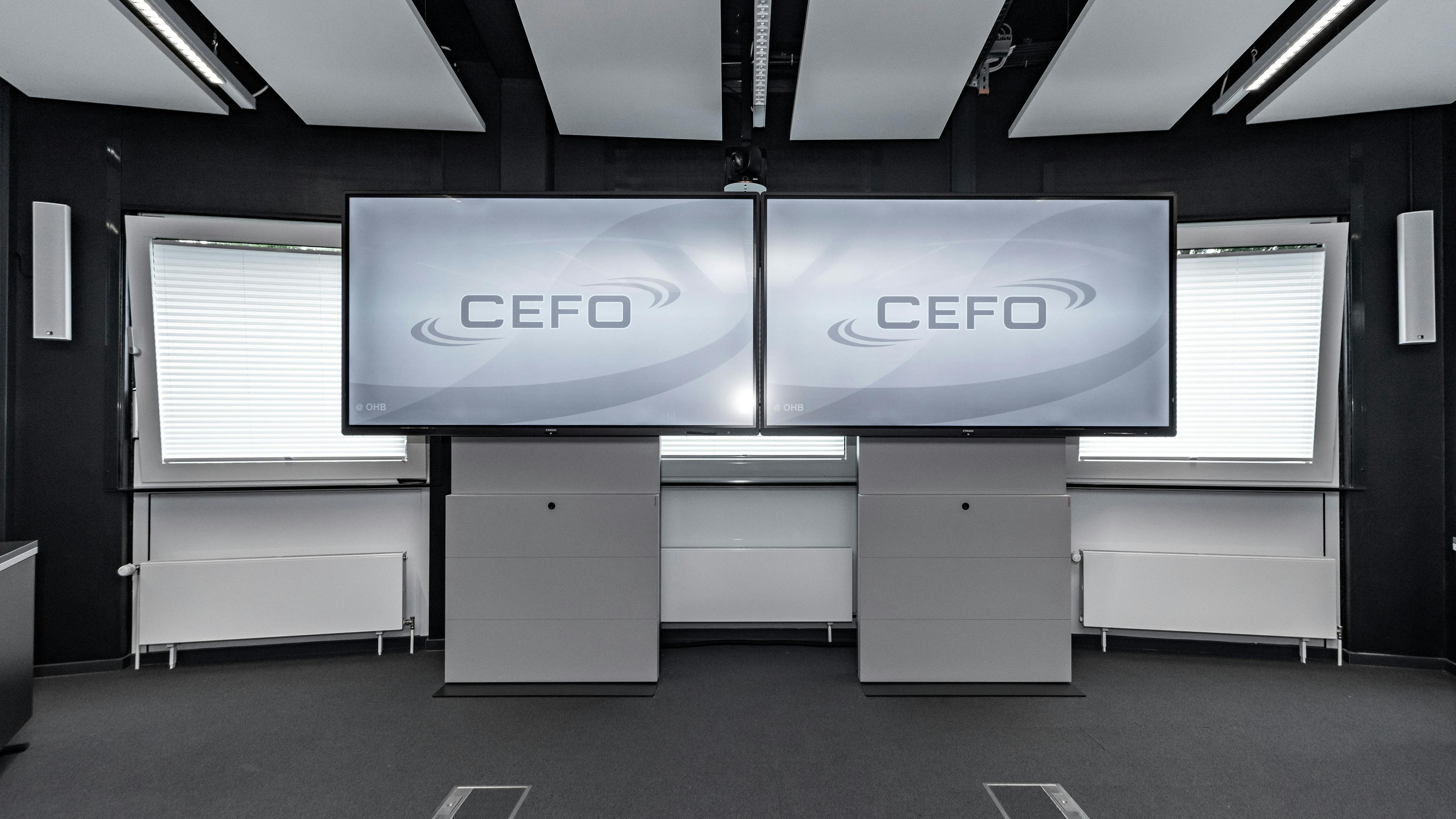 OHB Bremen I Konferenztisch Sonderlösung | Tischanschlußfelder in Sonderausführung | gepulverte Tischplatten und revisionierbare Beinraumblenden | Unterbauten für Medientechnikintegration | Schubladen für Tablet-Verwahrung | Integration von Bildschirmhalterungen