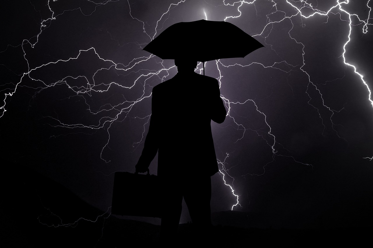 Businessman im Gewitter-Leitbild