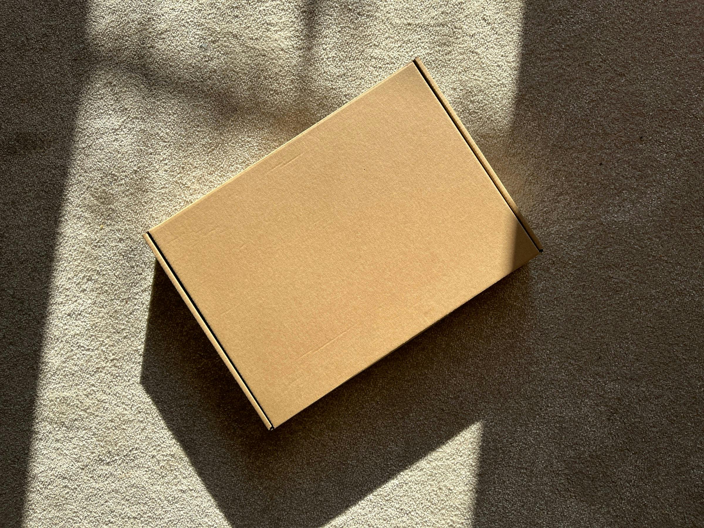 a brown box on a beige carpet