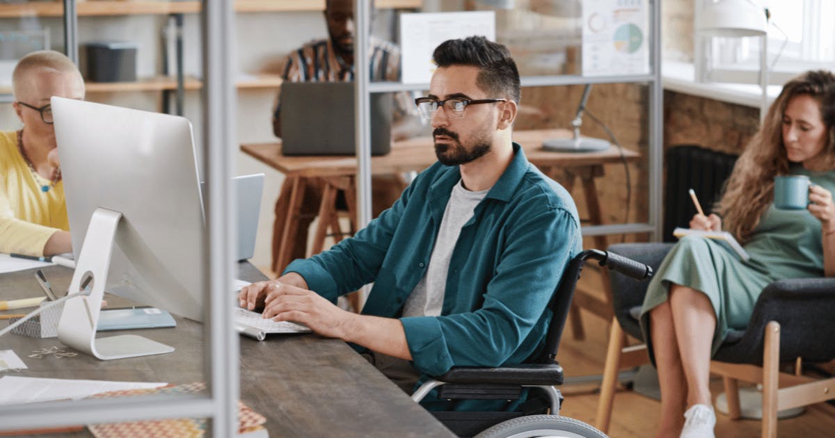 Trendy office with team focussing on work using computers - Future Connected Fibre