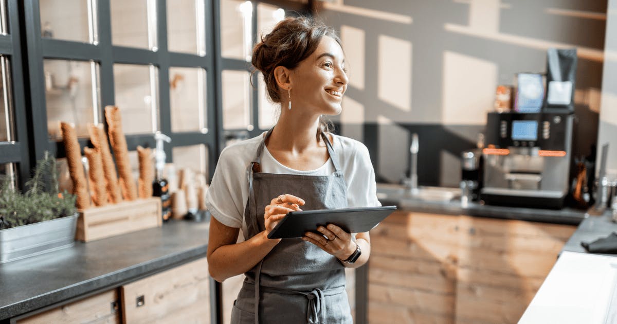 Barista taking an order on a tablet - tailored business solutions - Future Connected Fibre