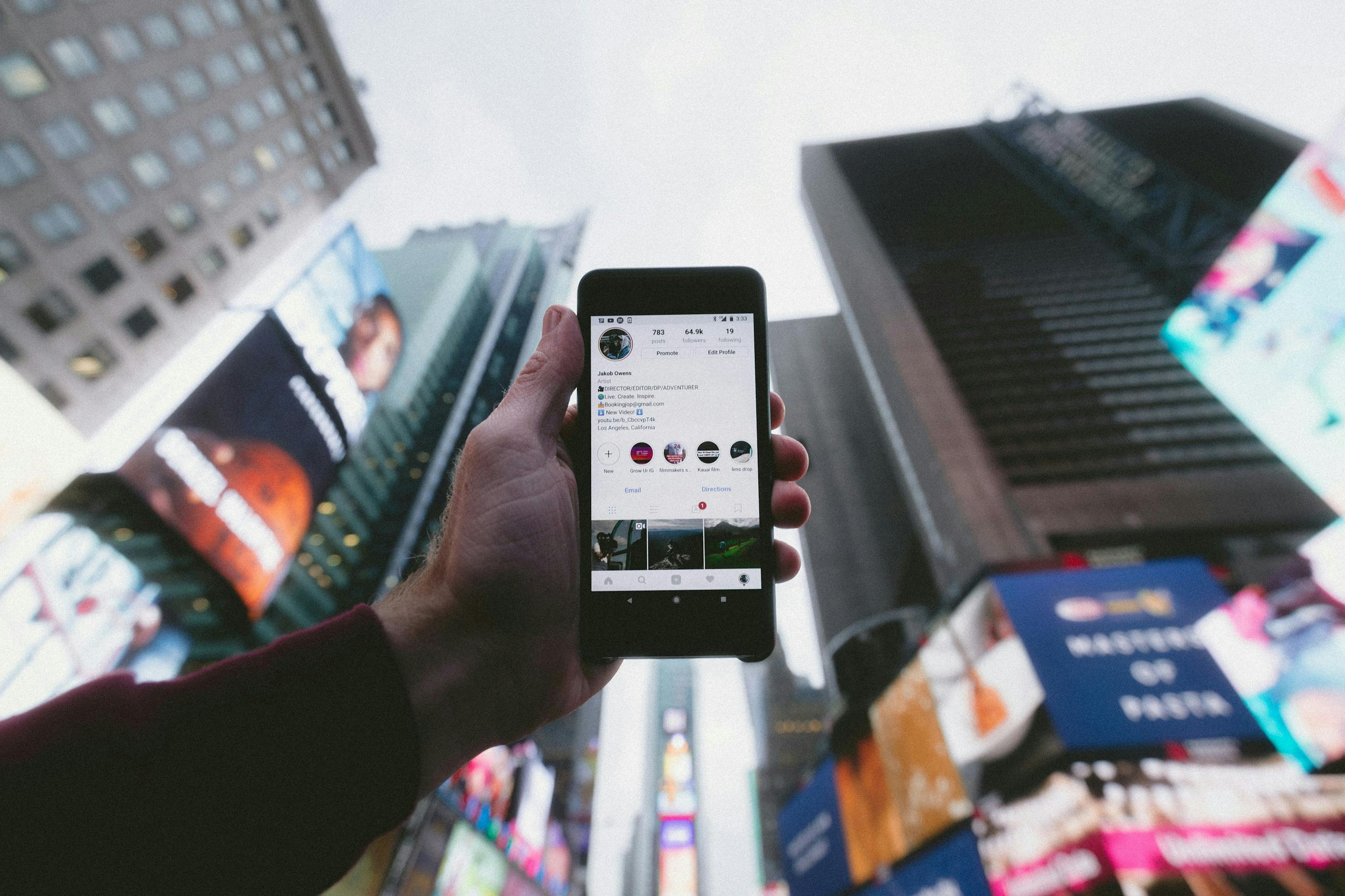 Traveler's phone displaying important travel information in a bustling cityscape in the digital world.