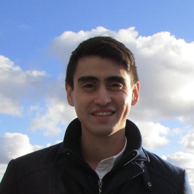 man with clouds in background