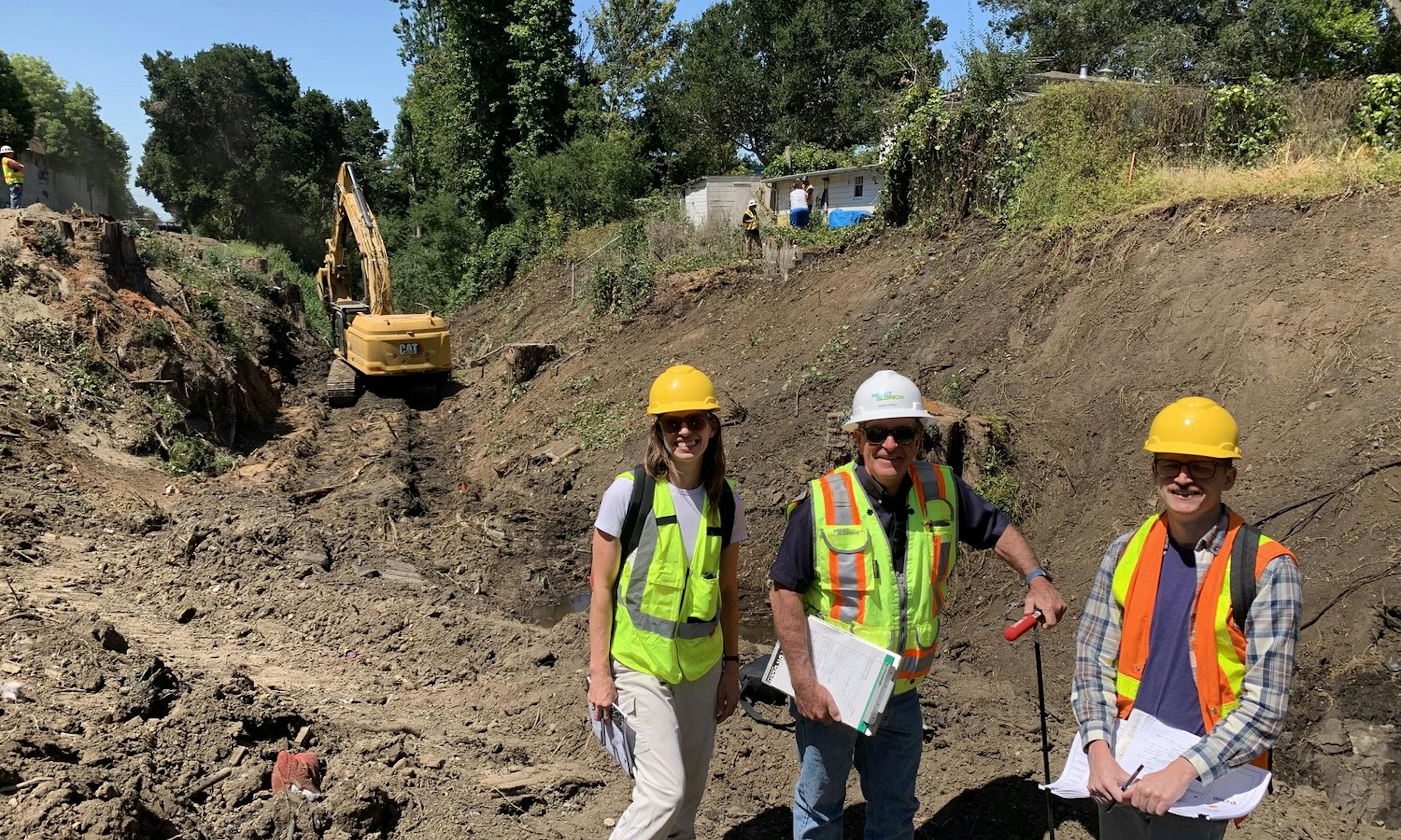 3 engineers pose for a photo at the job site