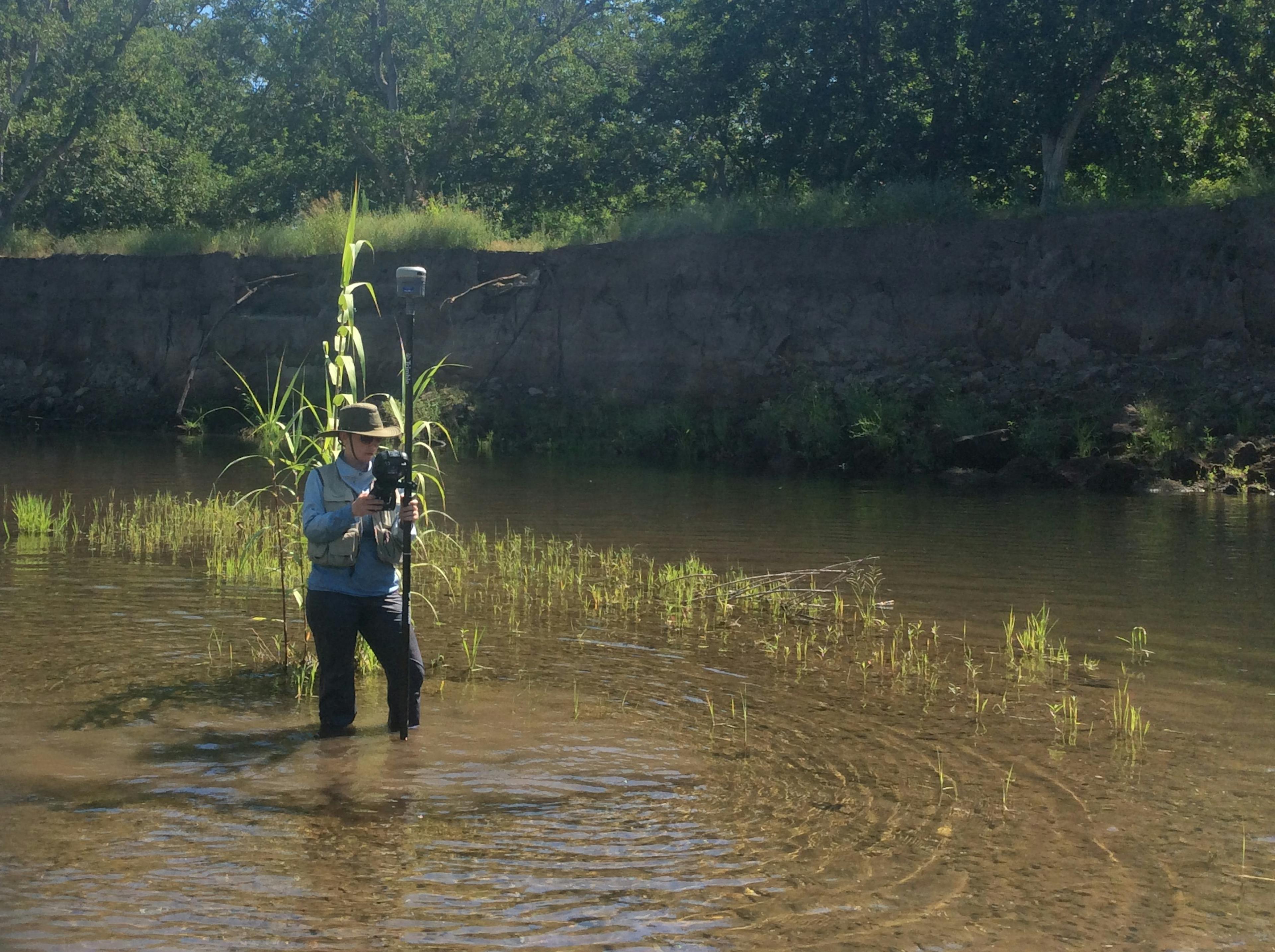 employee surveying deer creek
