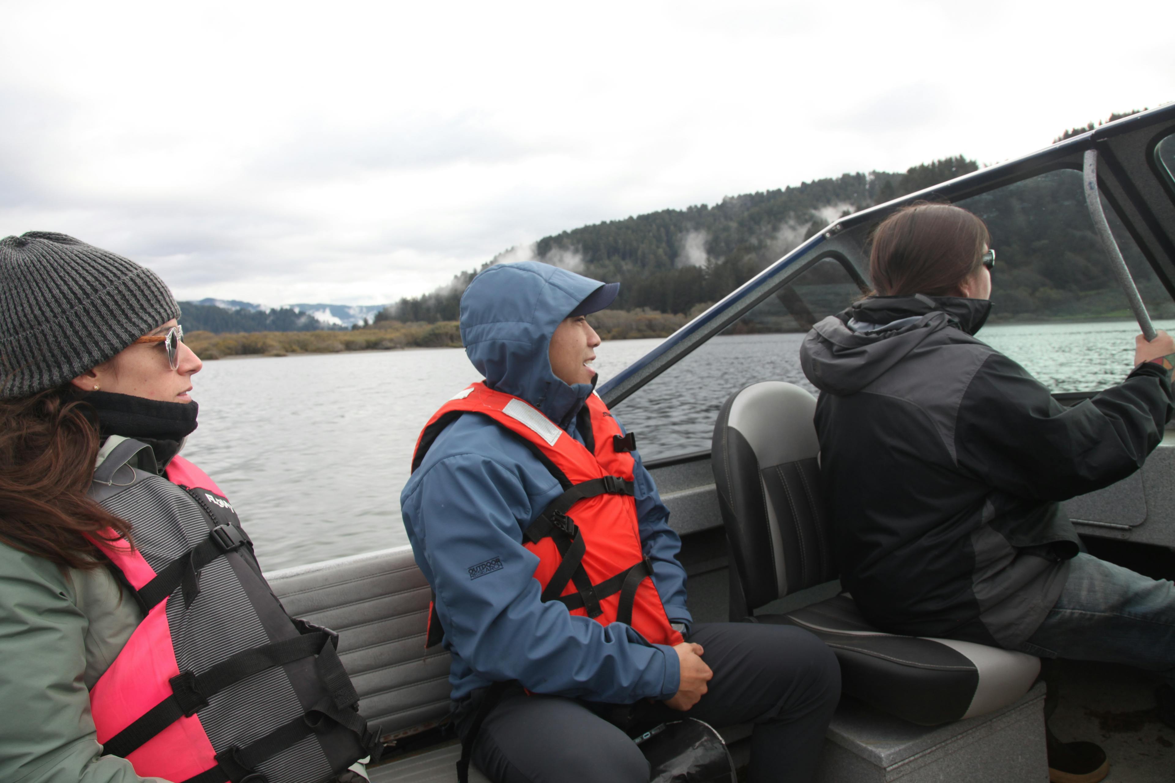 FlowWest staff on a boat with Yurok staff