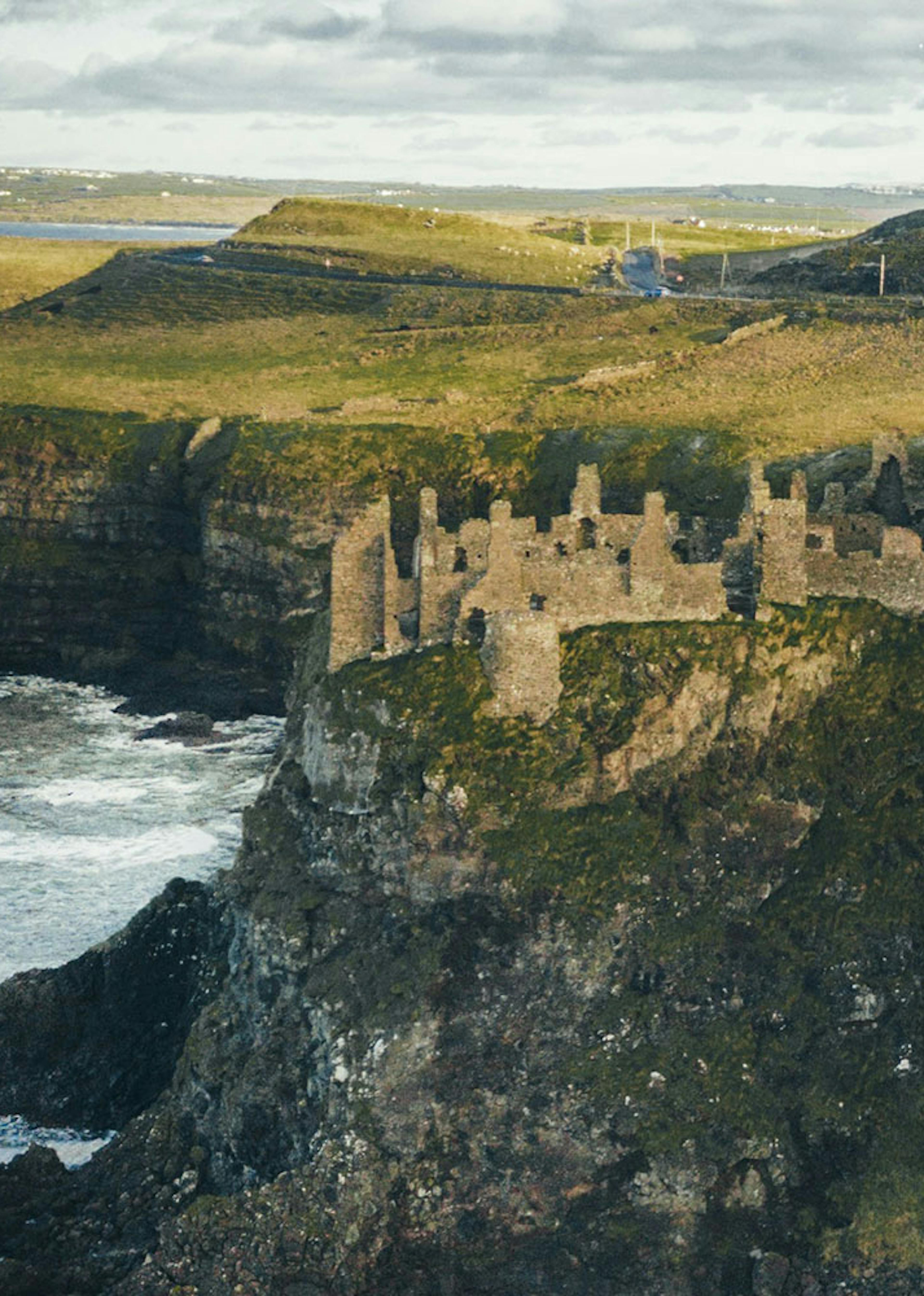 An Irish castle sits atop the cliffs of the island