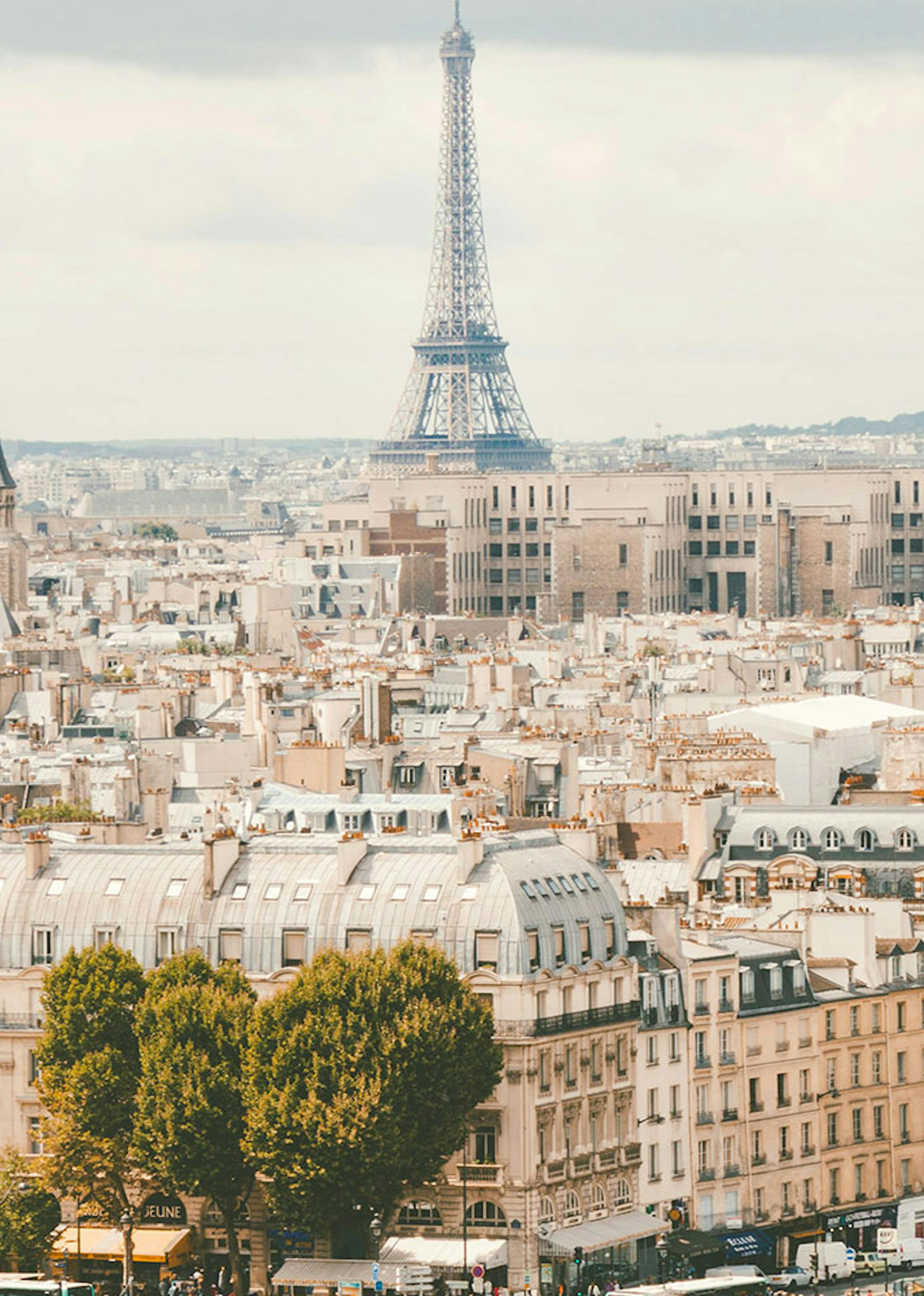 the city of Paris with the Eiffel tower in the center at the back