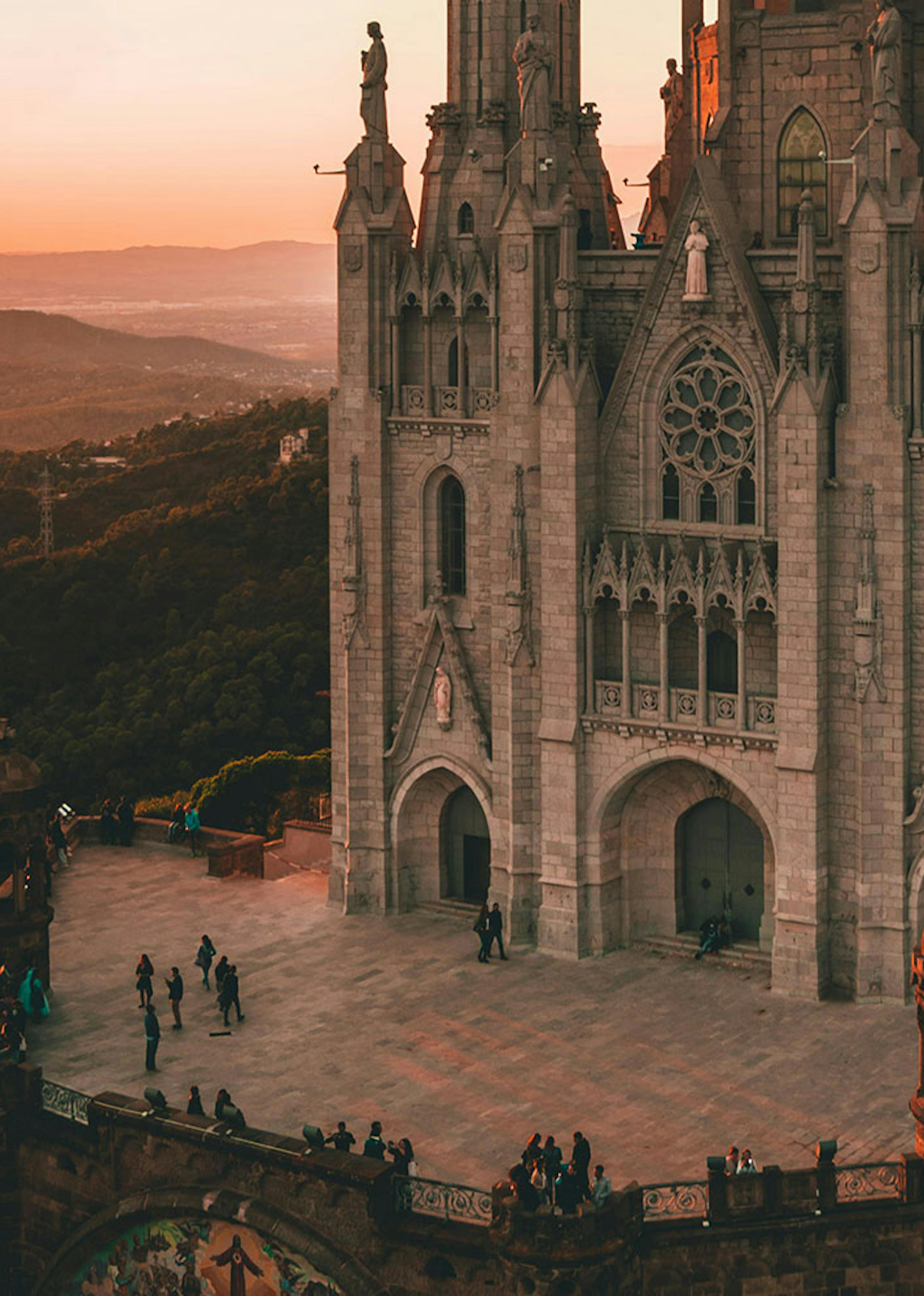 ornate cathedra sits on top of a hill with a dark mood for lighting