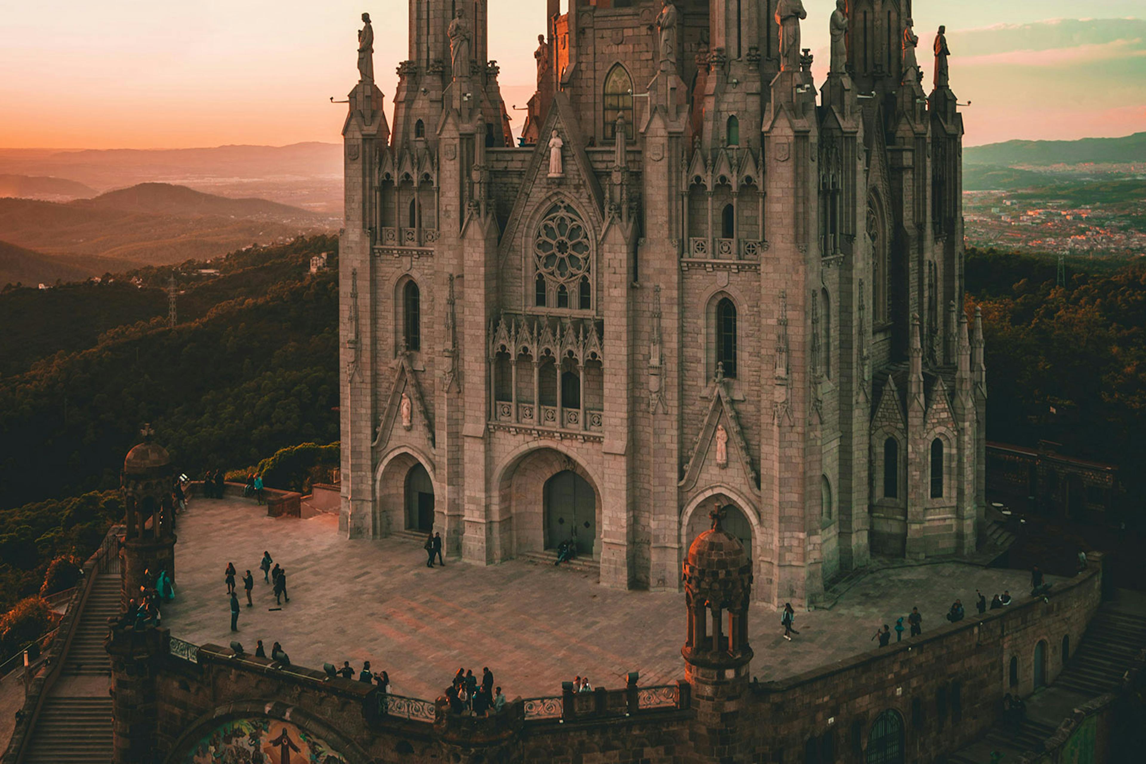 ornate cathedra sits on top of a hill with a dark mood for lighting