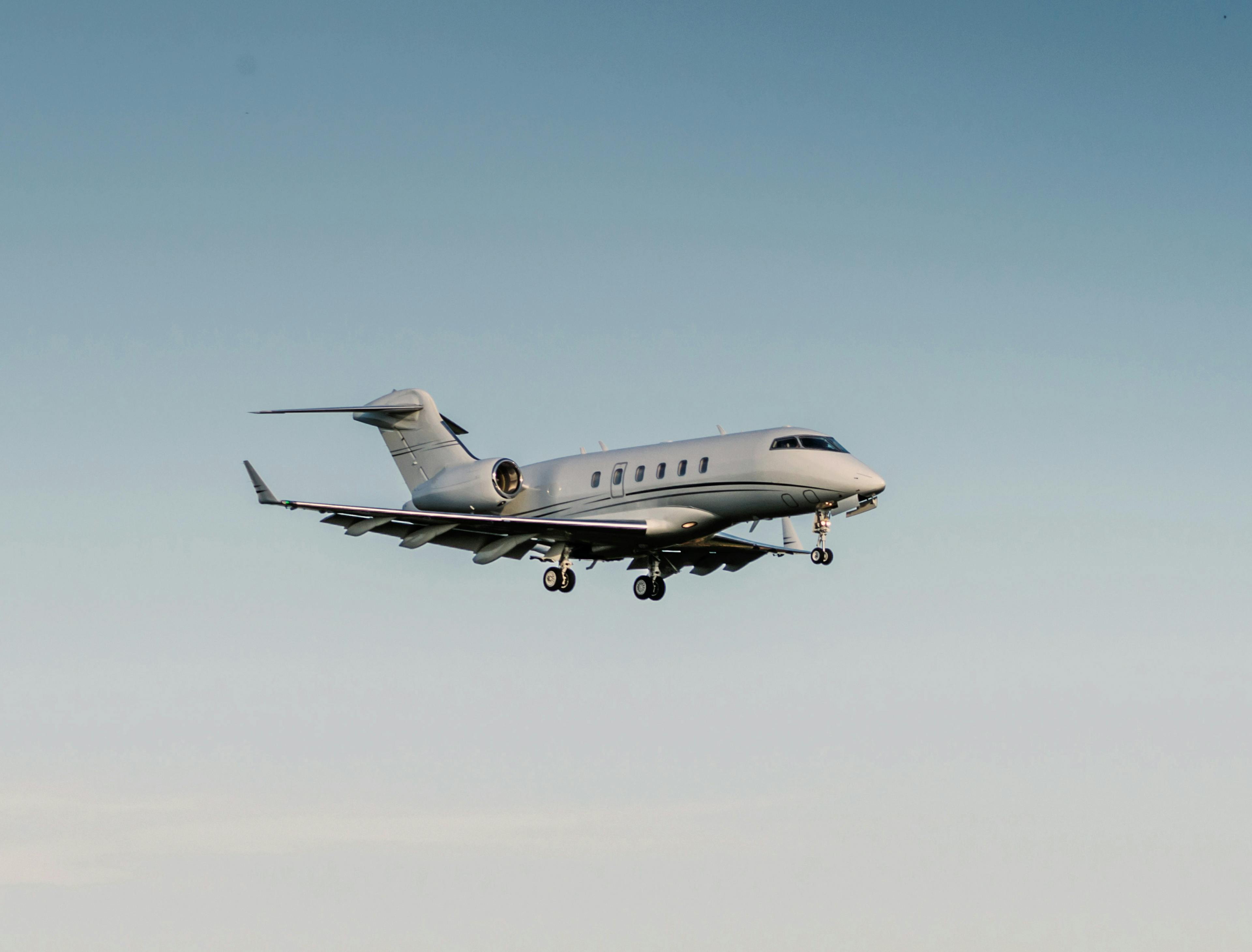 Challenger 300 flies in blue skies