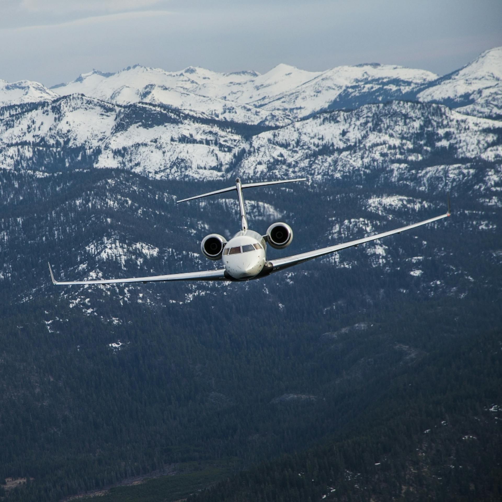 Global Express flying over mountains