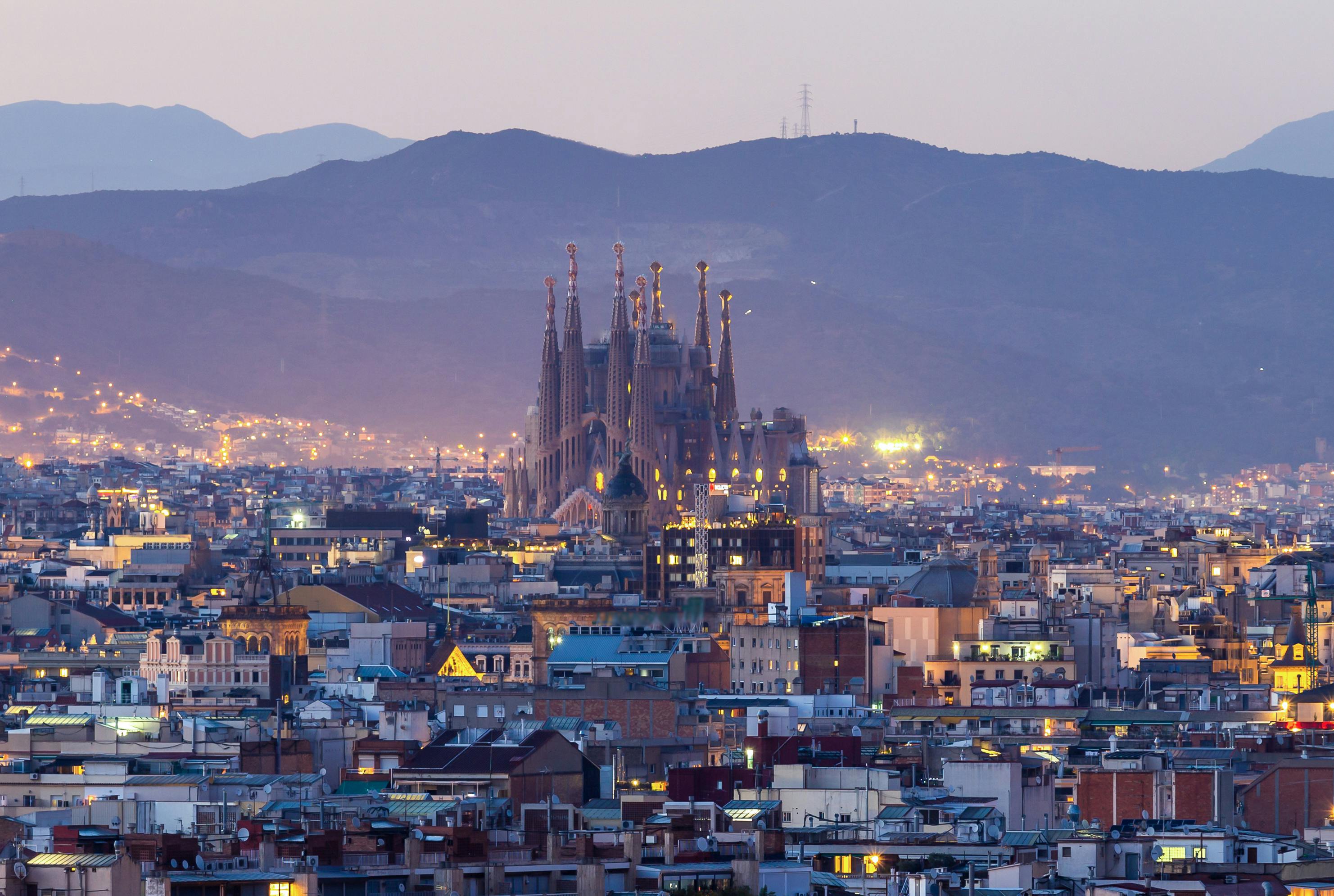 Aerial shot of Barcelona with a large cathedral in the center