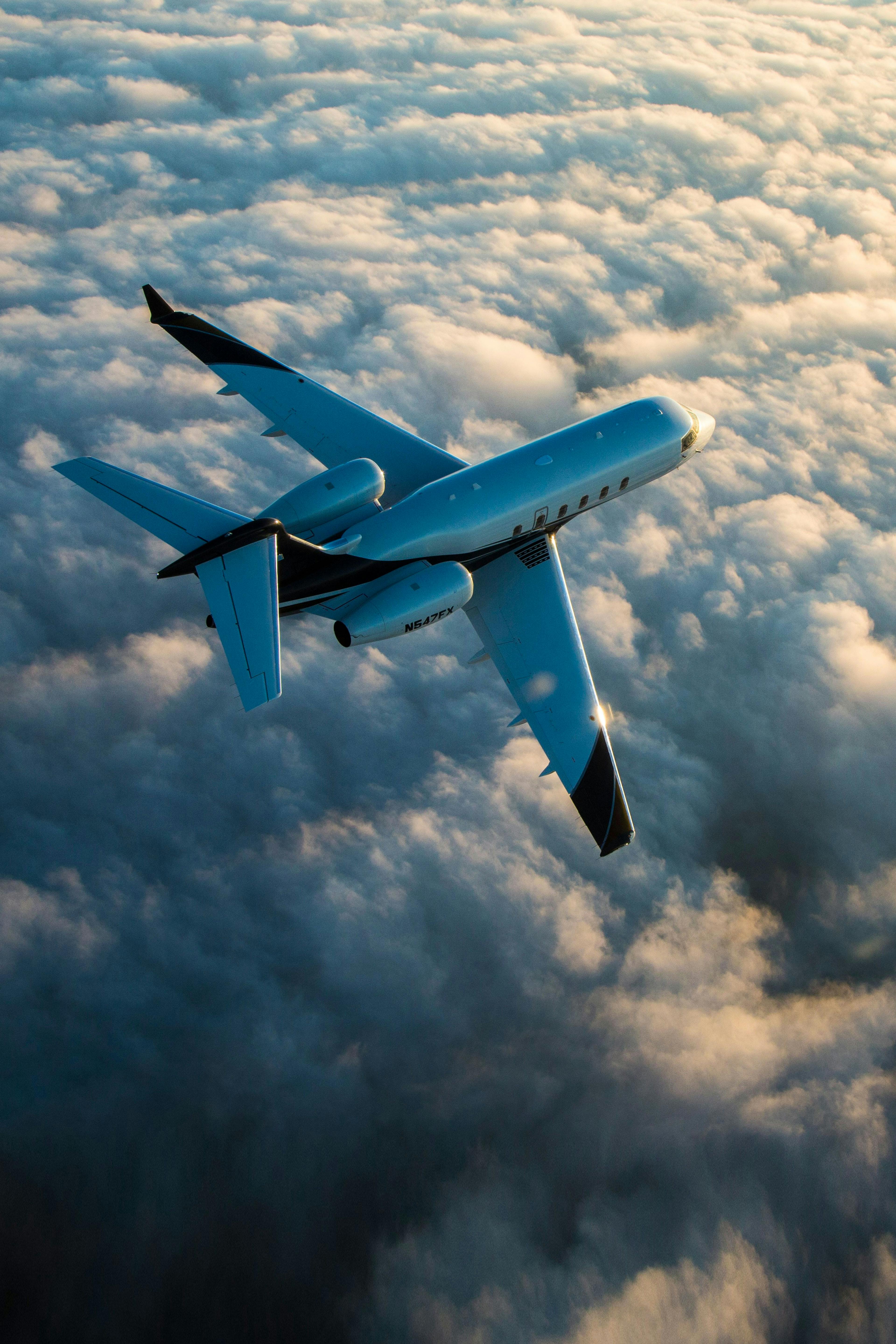 Challenger 300 against a background of clouds