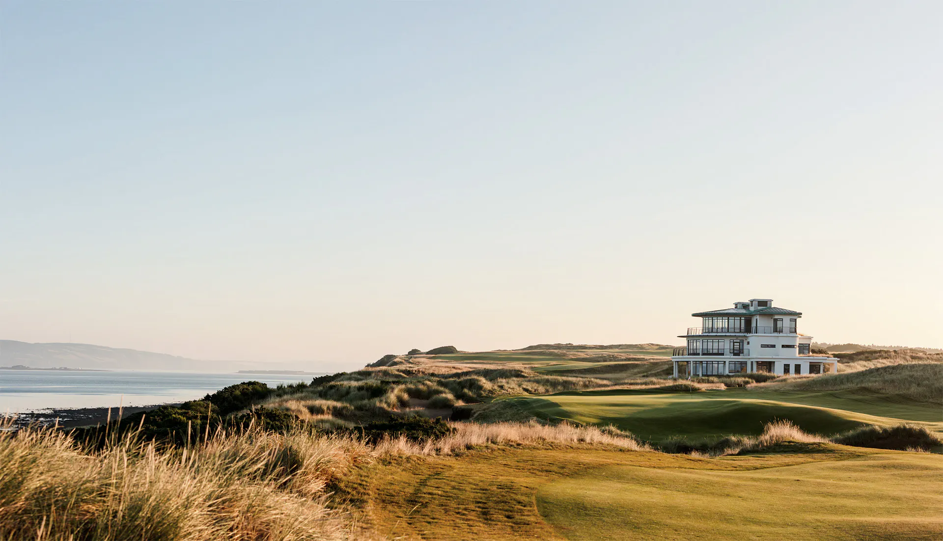 A lone house on a beautiful golf course on the water