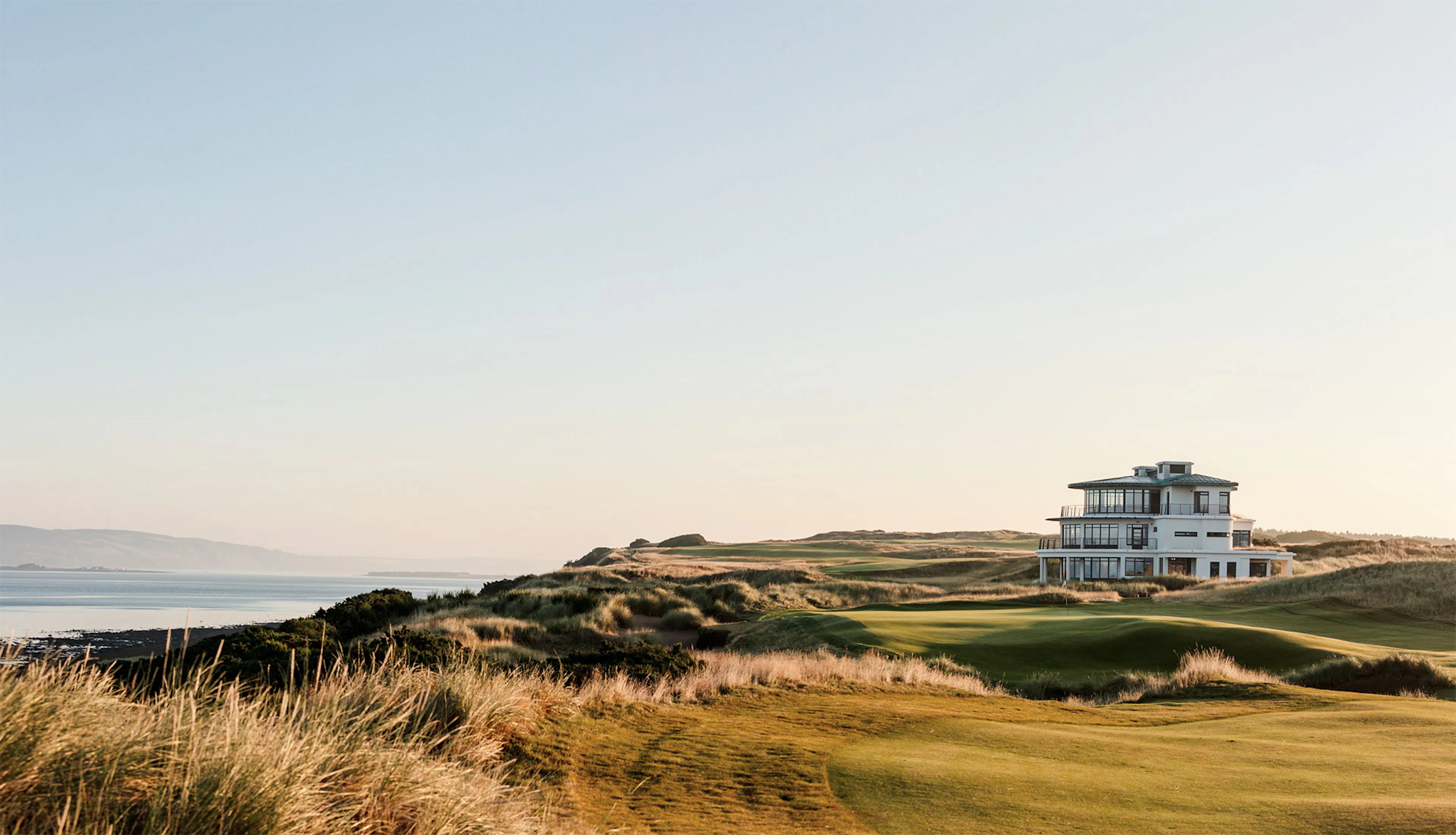 A lone house on a beautiful golf course on the water