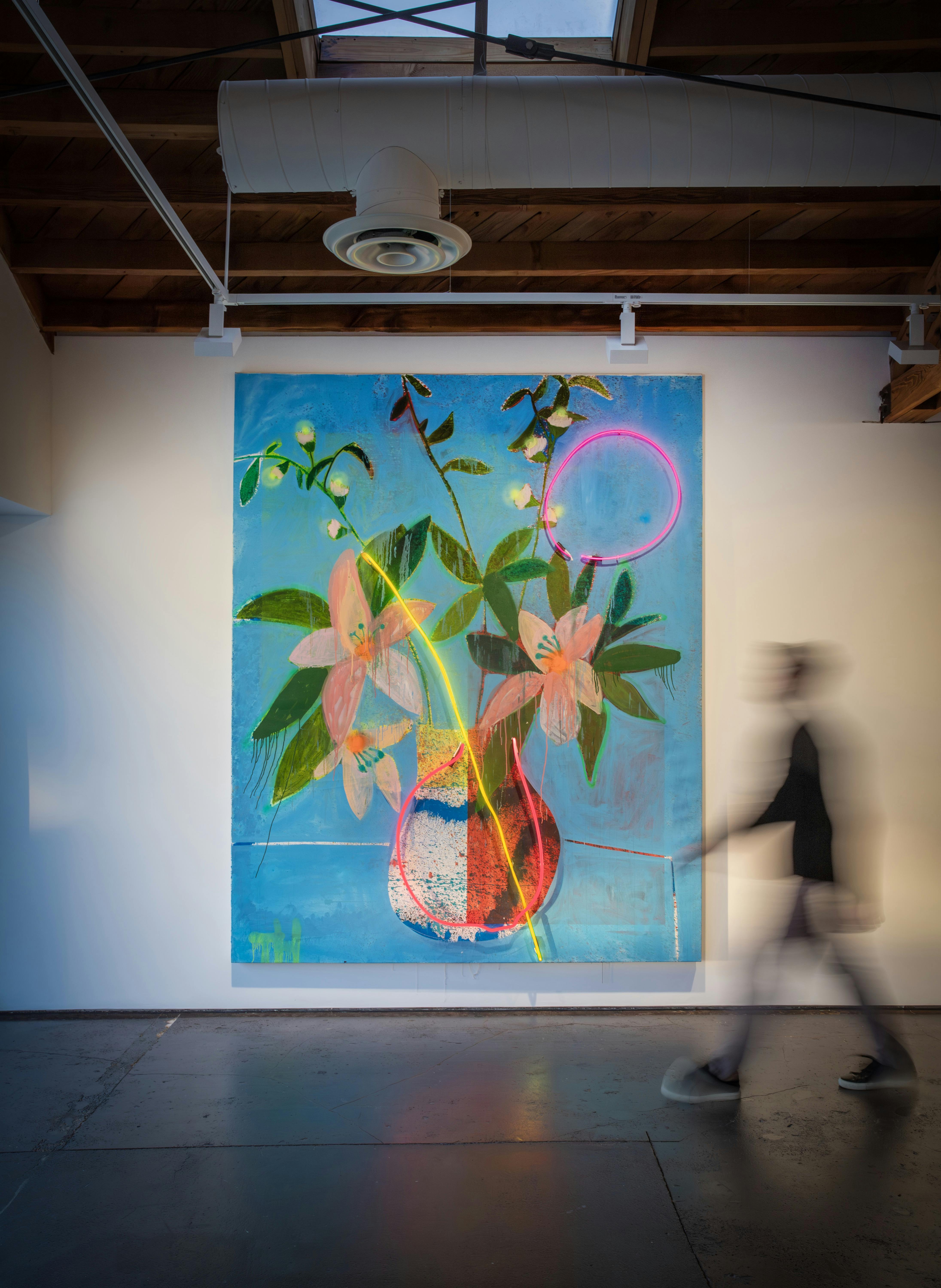 blurred man walking in gallery