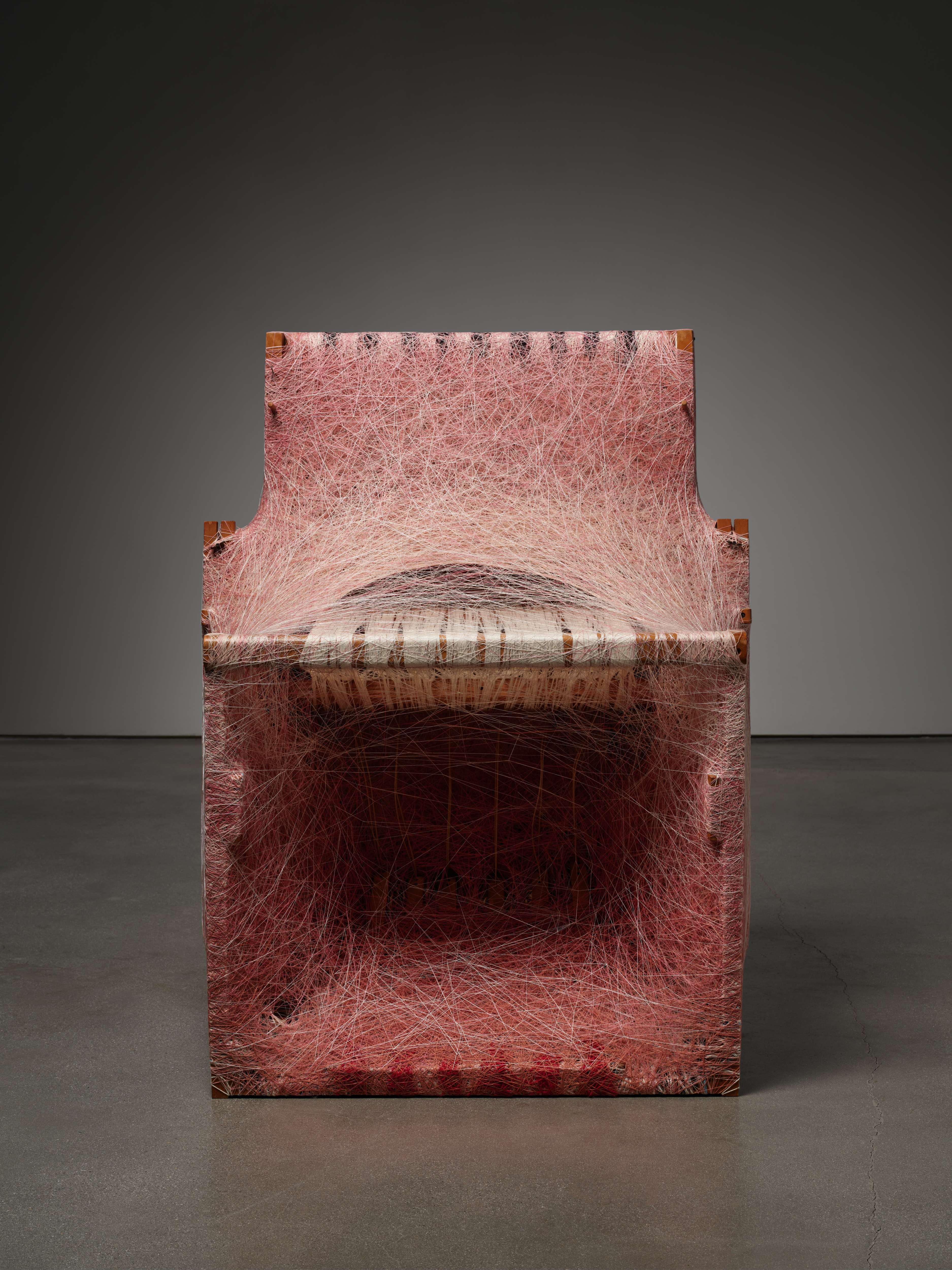 Sheng Lor, Loom 1, 2024 — dressed loom sculpture constructed from a wooden loom densely wrapped with cochineal- and madder root-dyed yarns, forming a deep, box-like textile structure.