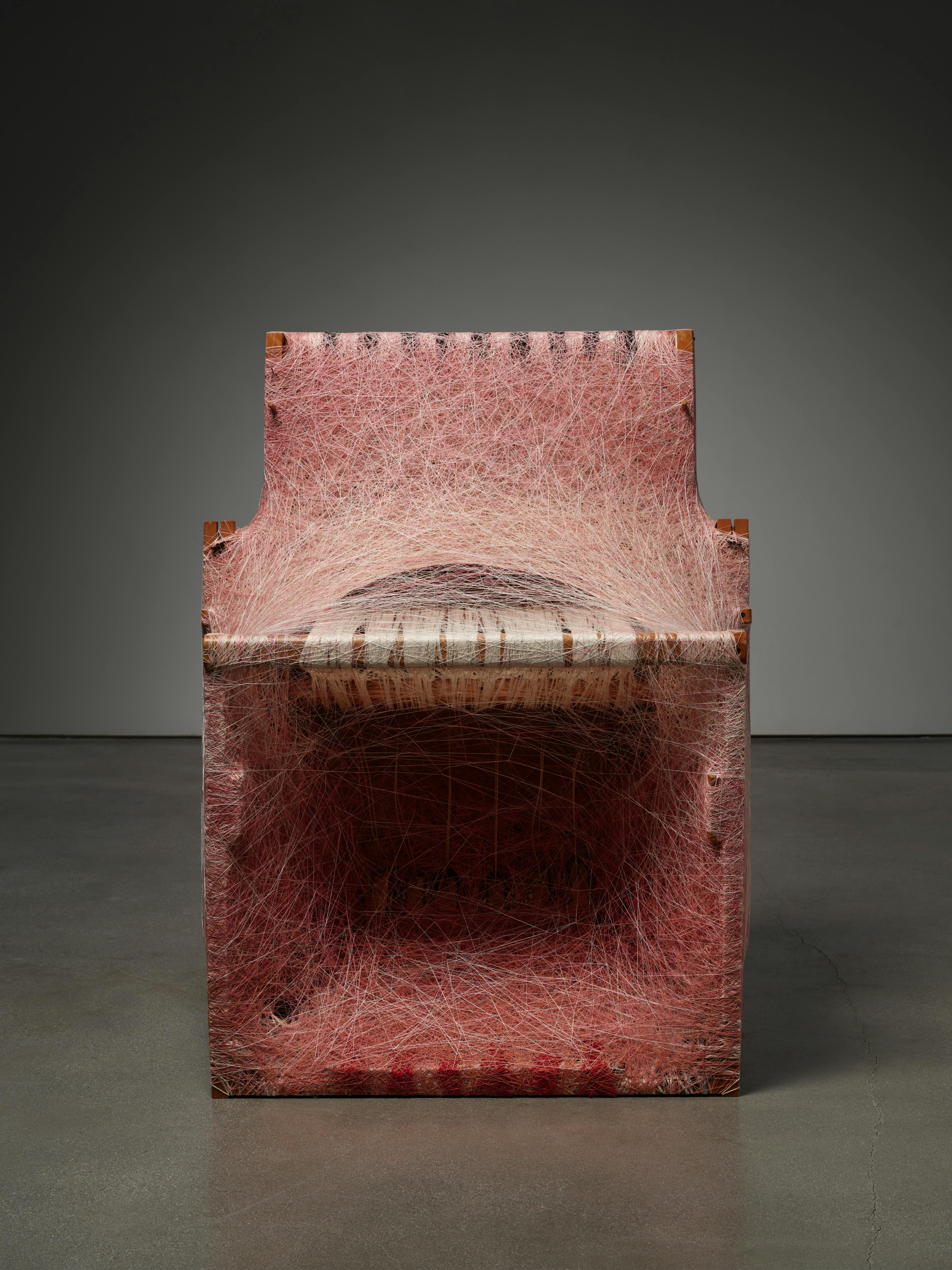 Sheng Lor, Loom 1, 2024 — dressed loom sculpture constructed from a wooden loom densely wrapped with cochineal- and madder root-dyed yarns, forming a deep, box-like textile structure.