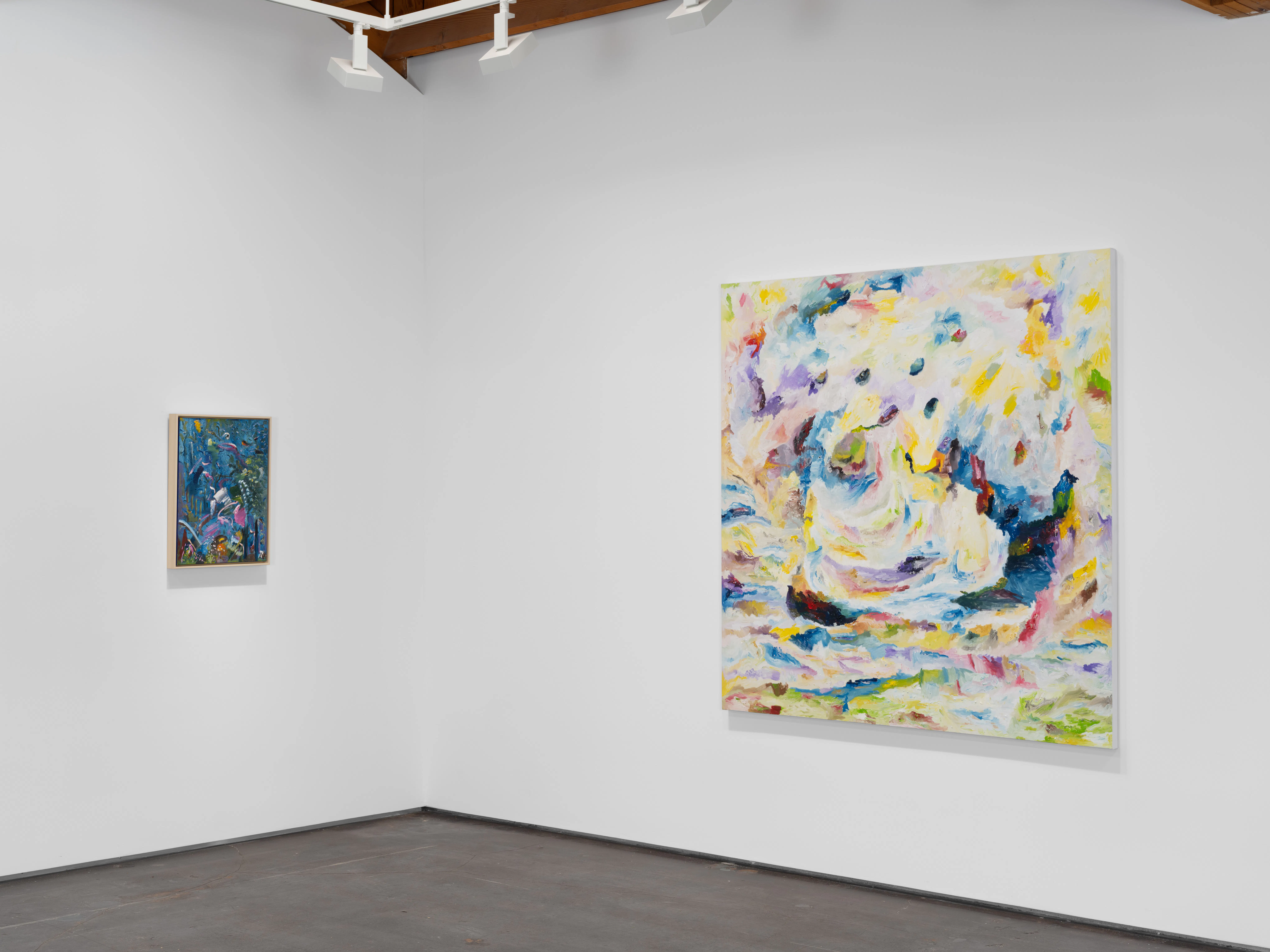 Angled gallery installation view of Moncho’s Awakening exhibition featuring colorful geometric abstract paintings at Gallery Sonder.