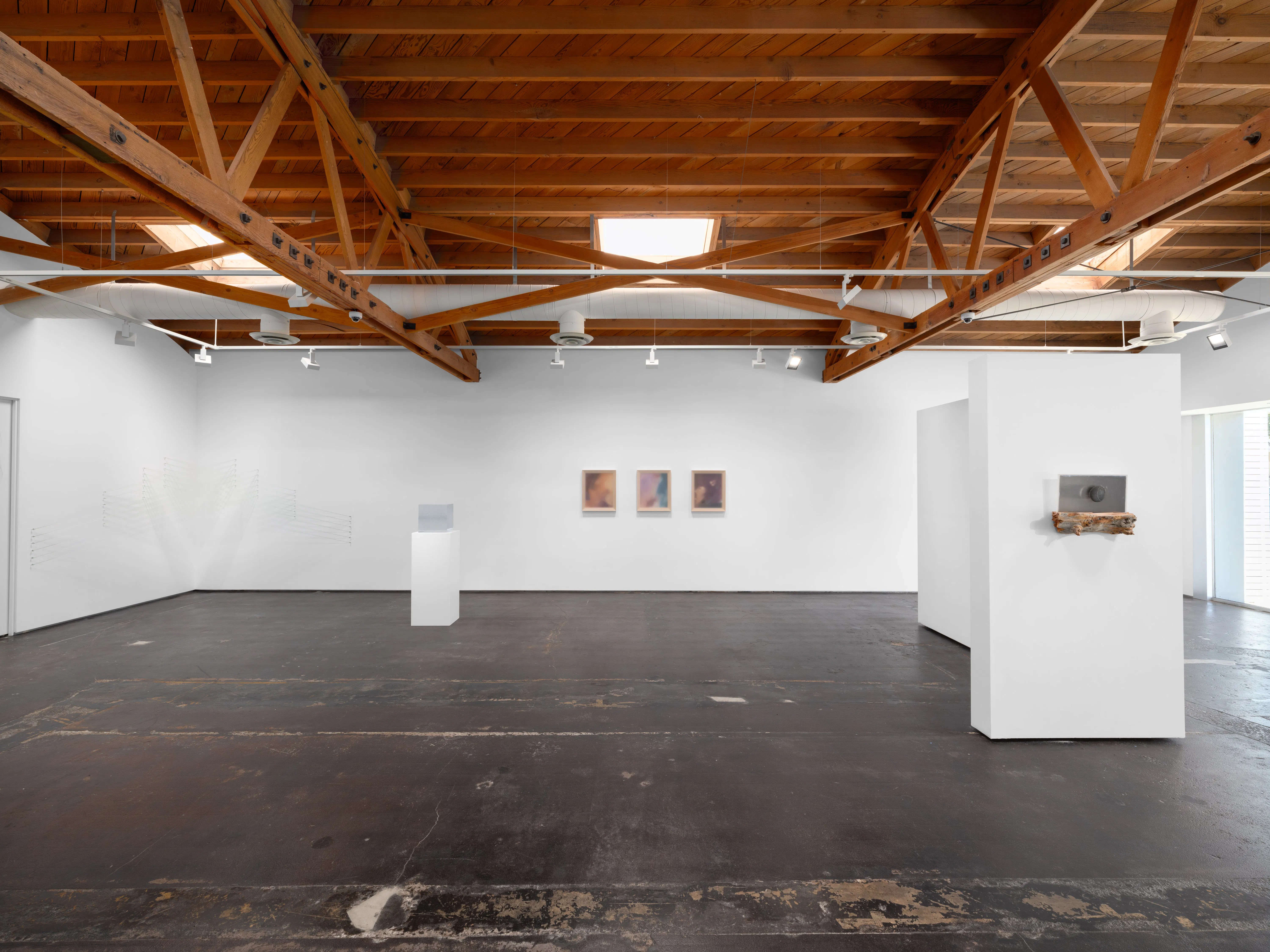 Wide installation view of Keeping Things Whole at Gallery Sonder, with works across the gallery, exposed wood ceiling beams, and sculpture on a pedestal.