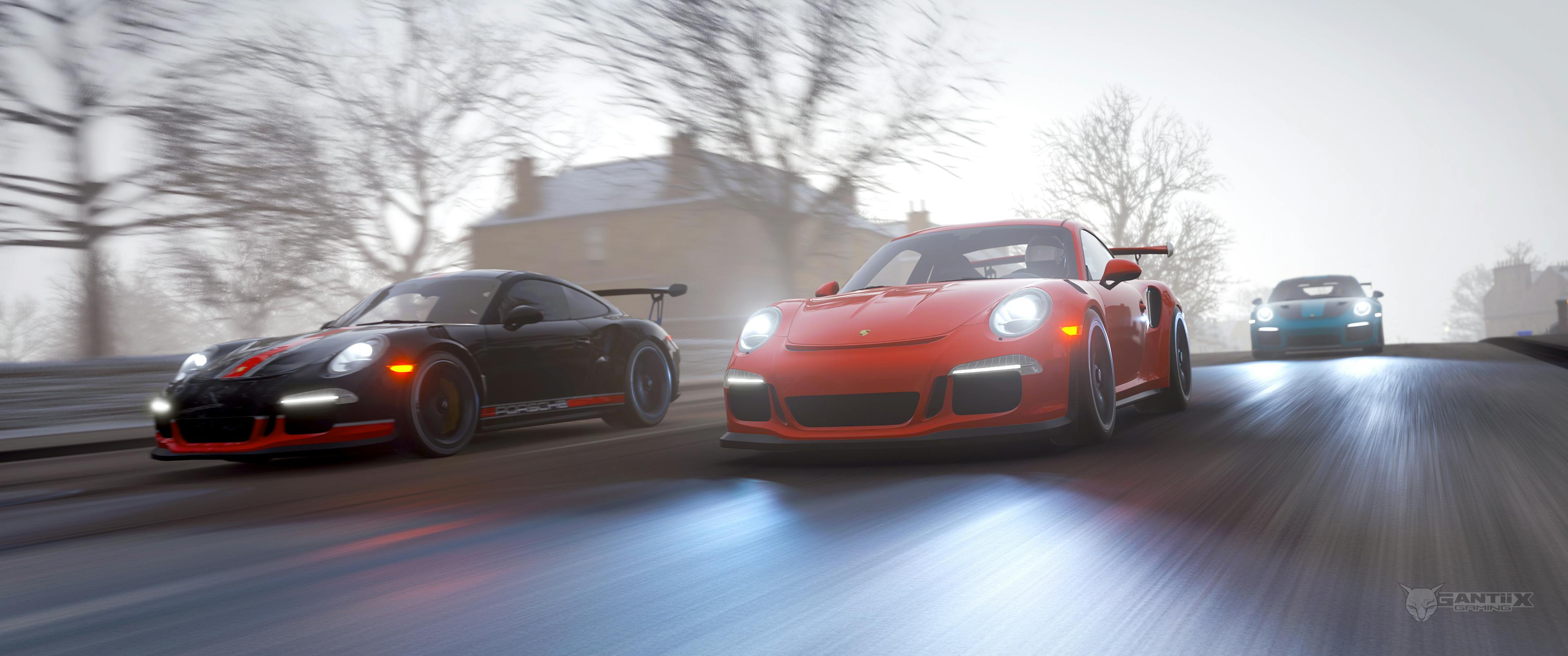 Three Porsche 911 GT3 RS racing