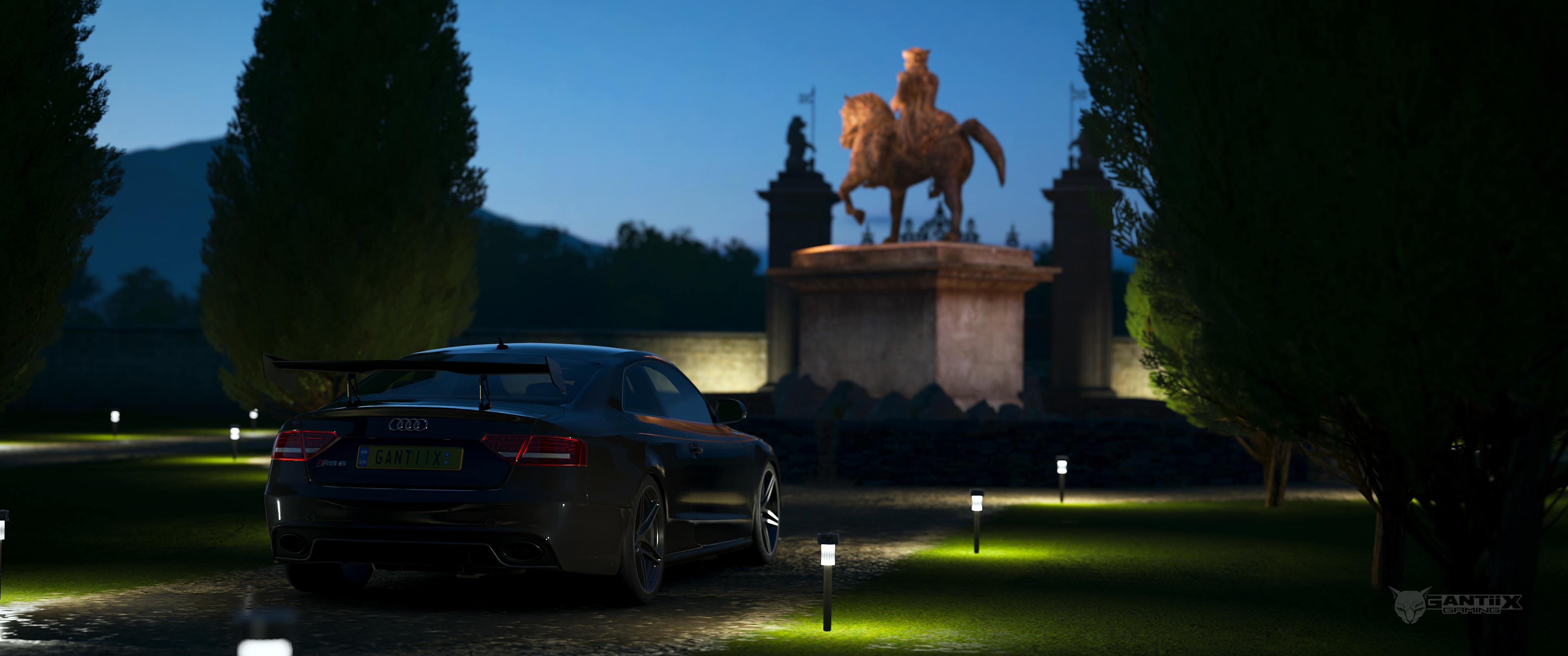 Audi RS5 in mansion at night